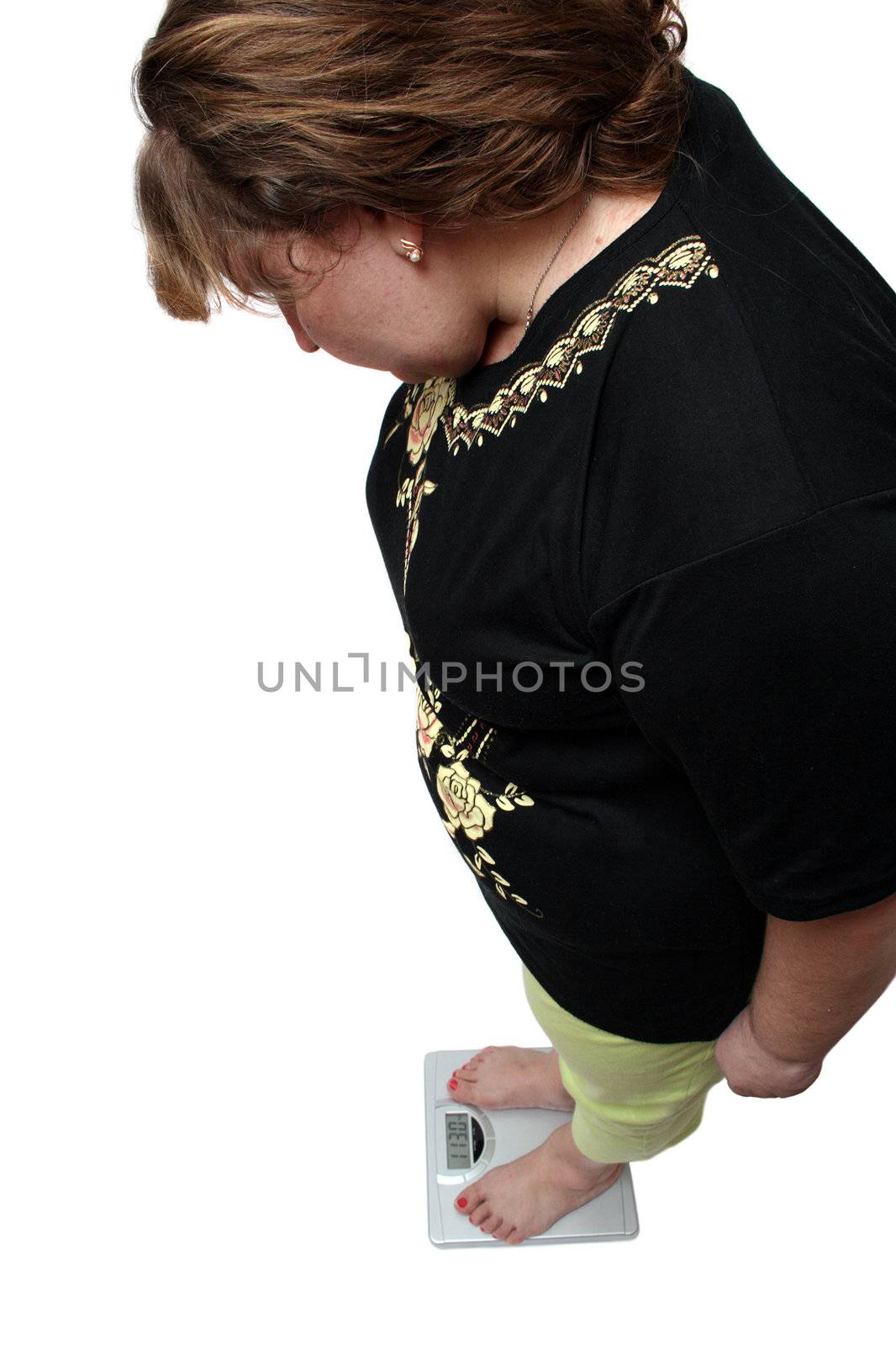 women with overweight looking on scales by Mikko