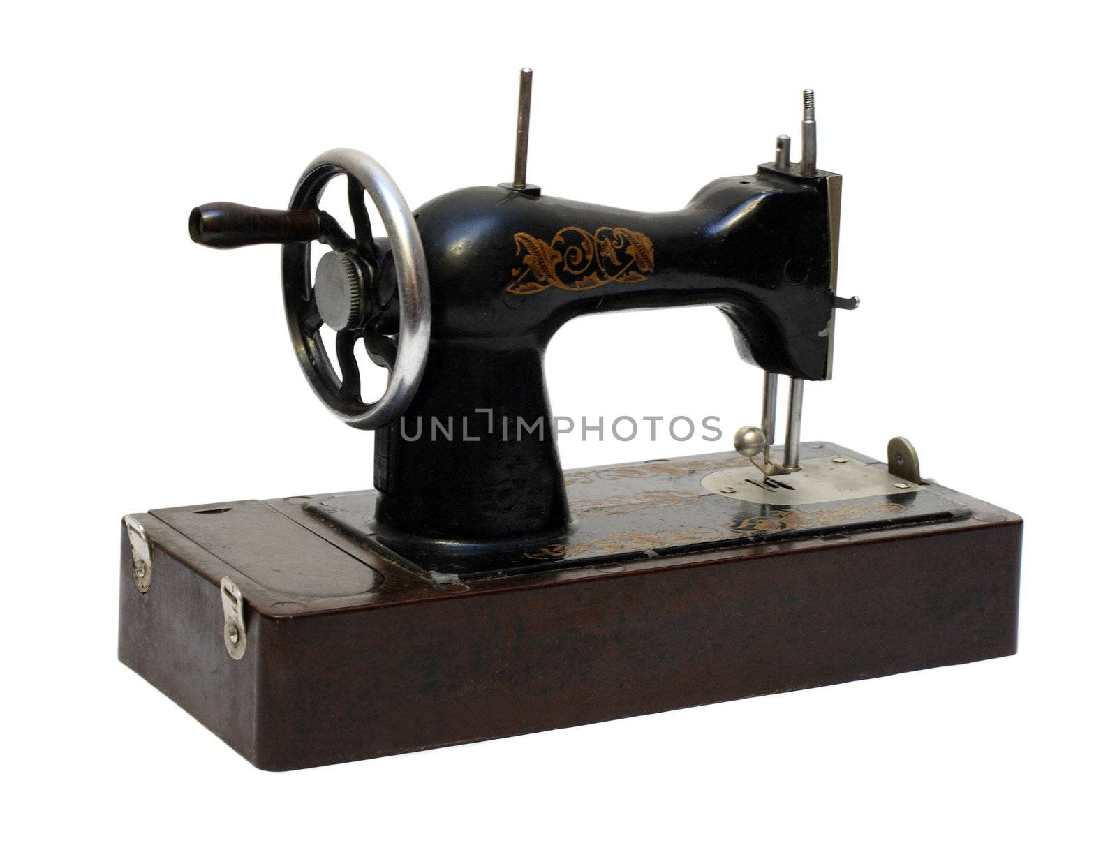 old sewing machine isolated on white