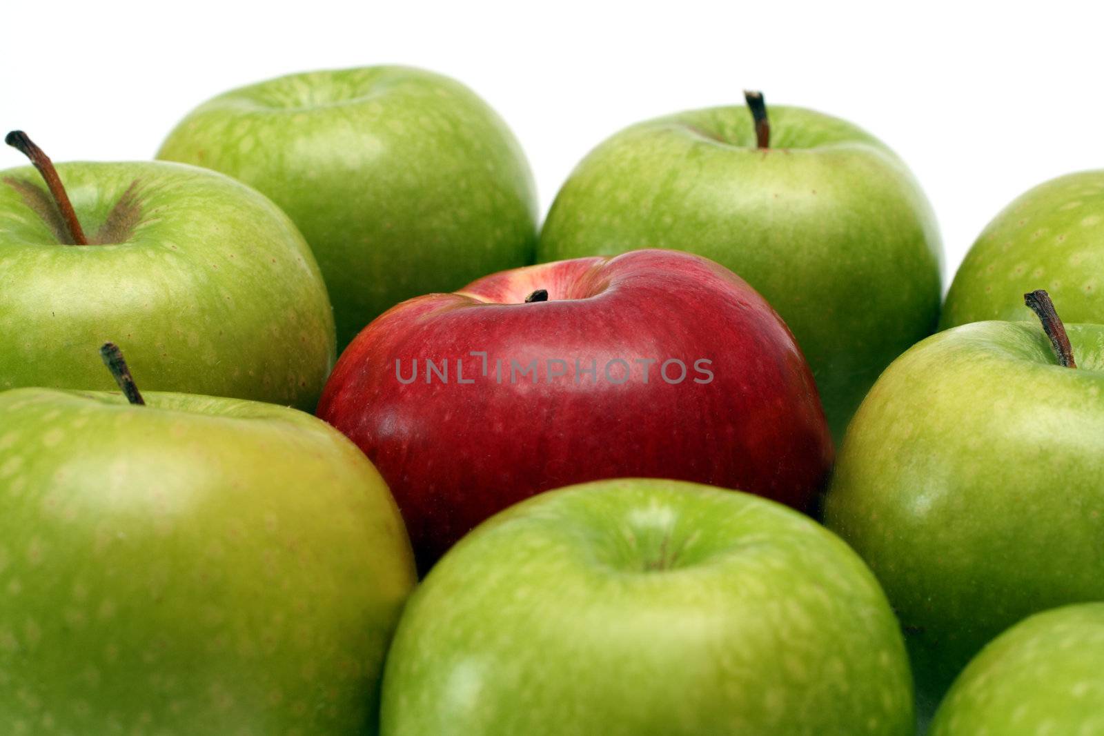 separation concepts - red apple between green apples
