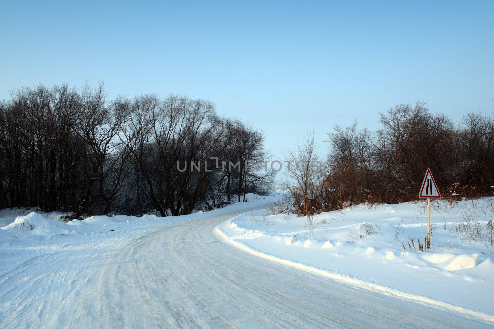 winter road with sign by Mikko