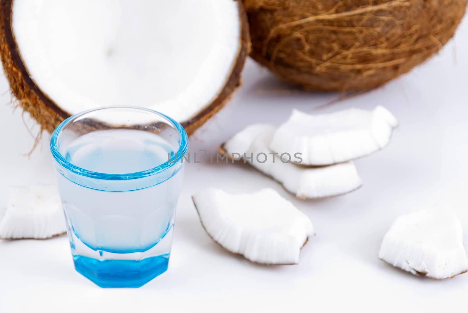 freshly cut coconut and milk isolated on white background