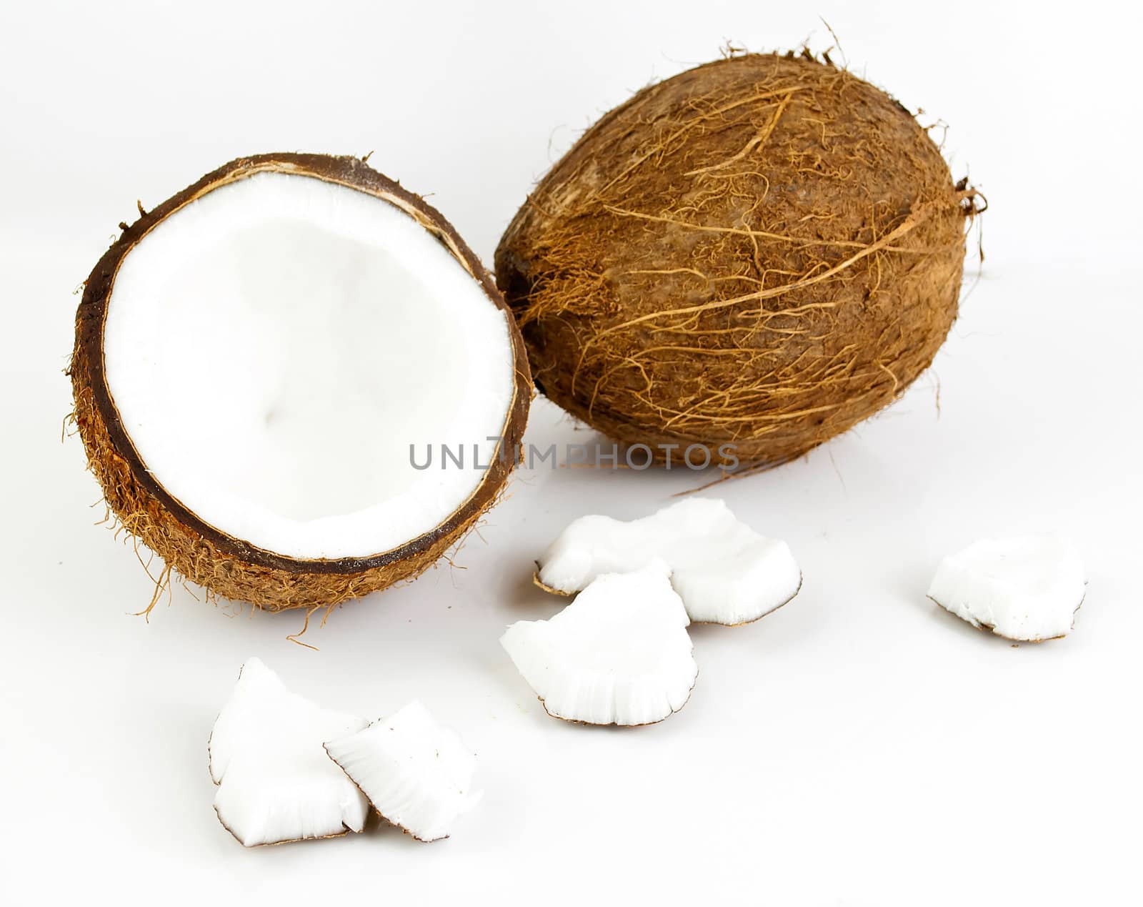 freshly cut coconut and milk isolated on white background