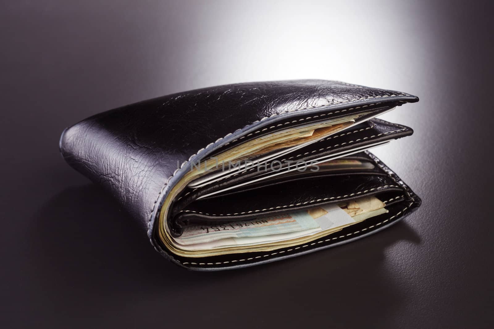 stock image of the wallet full of money