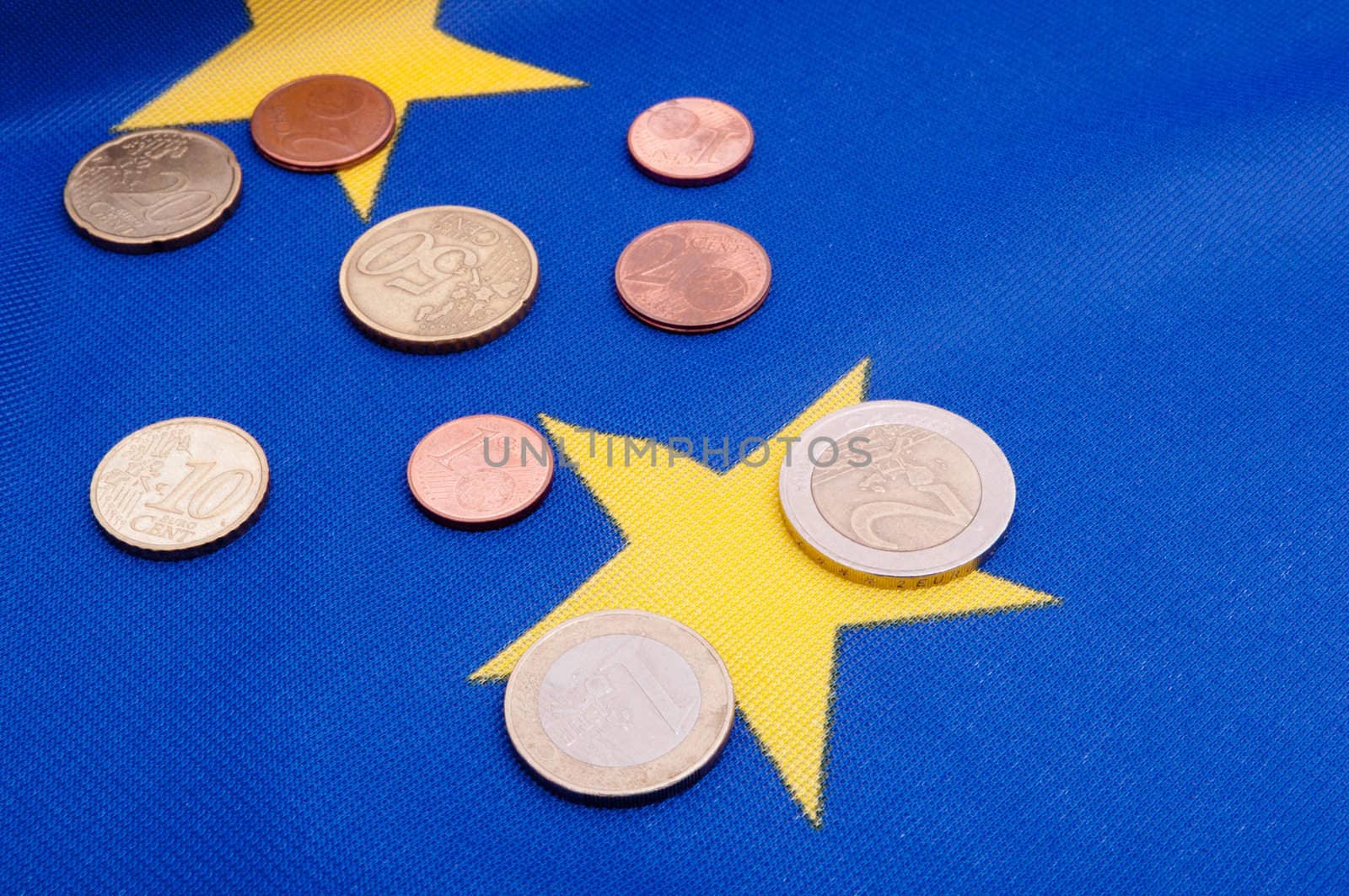 Euro Coins on Blue Flag of European Union