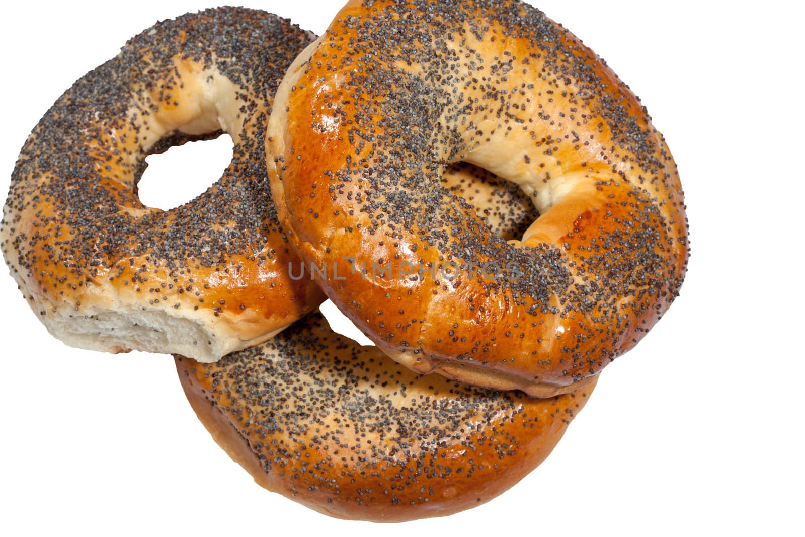 bagels with poppy seeds on white background by sfinks