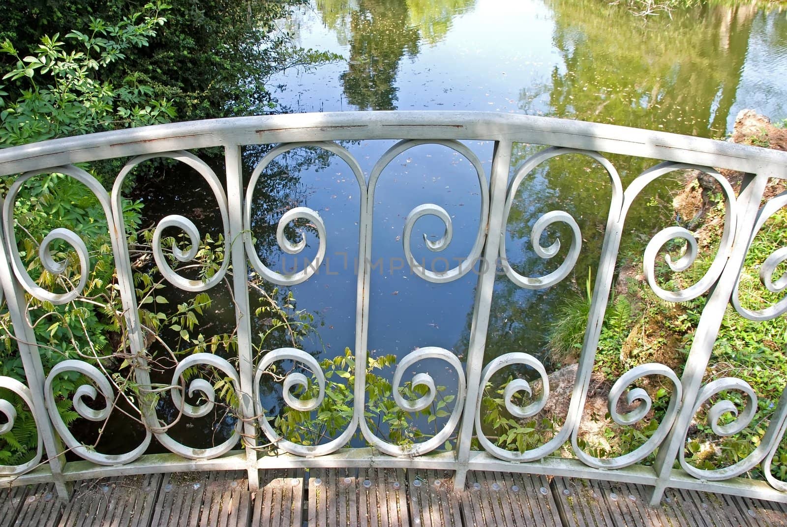 wrought iron fence on a small bridge (France Europe)