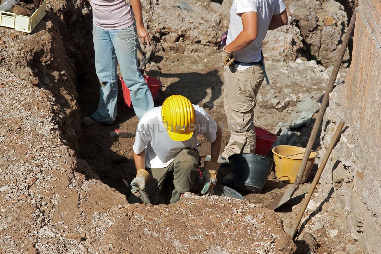 scientists conducting archaeological excavations on an ancient site in Rome Italy