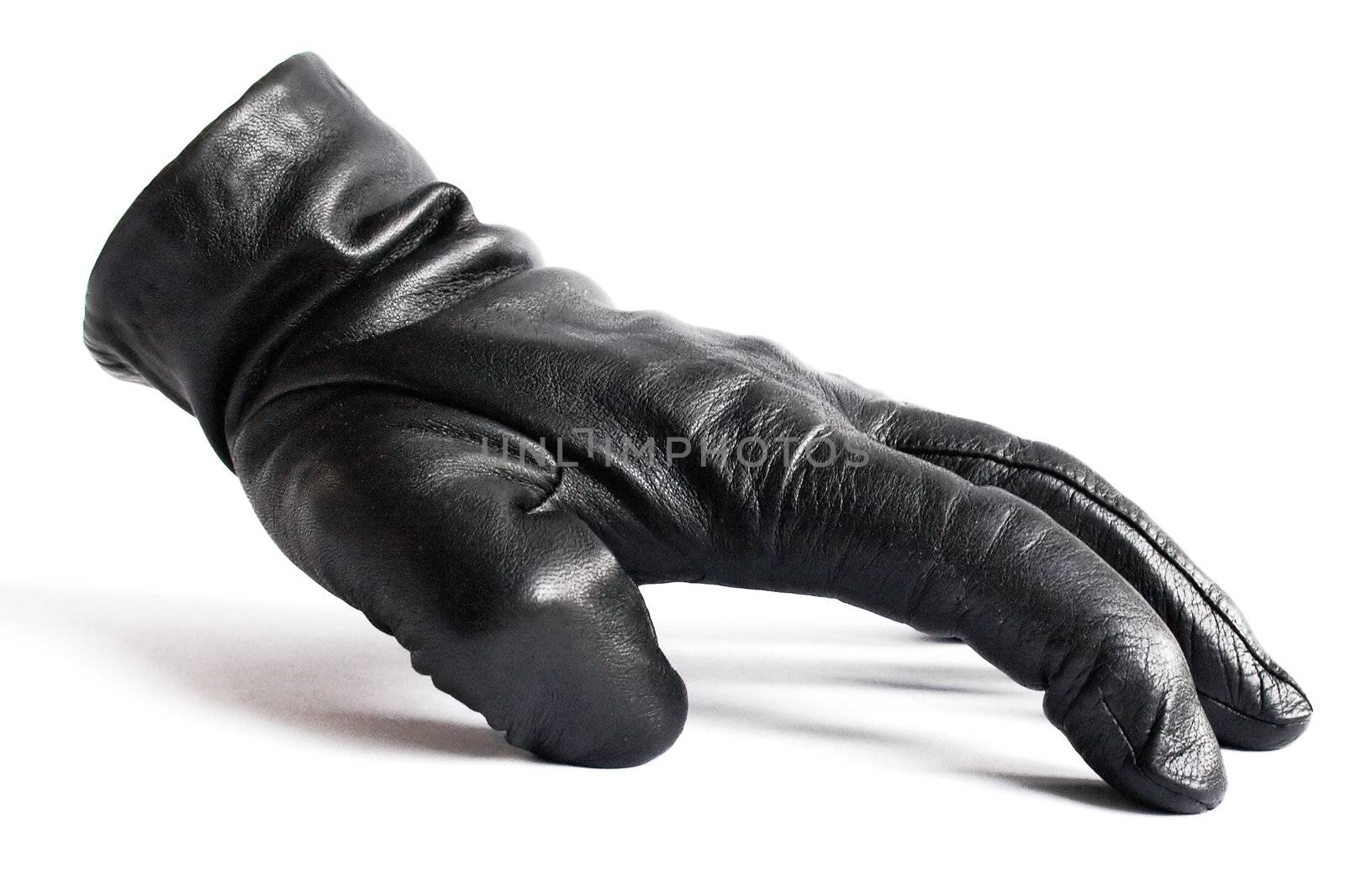 Spooky black leather glove isolated on a white background.