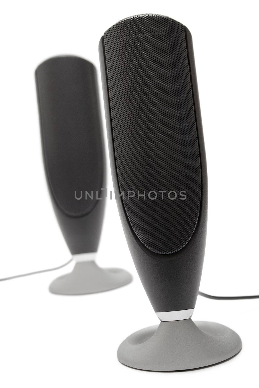 Two small black speakers isolated on a white background.