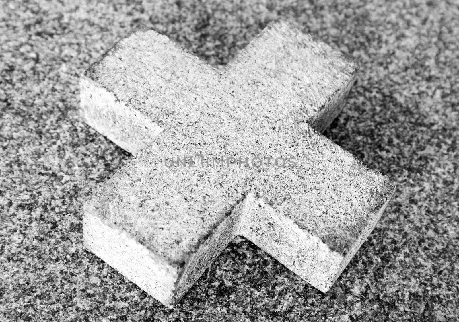 Simple stone cross in a church.