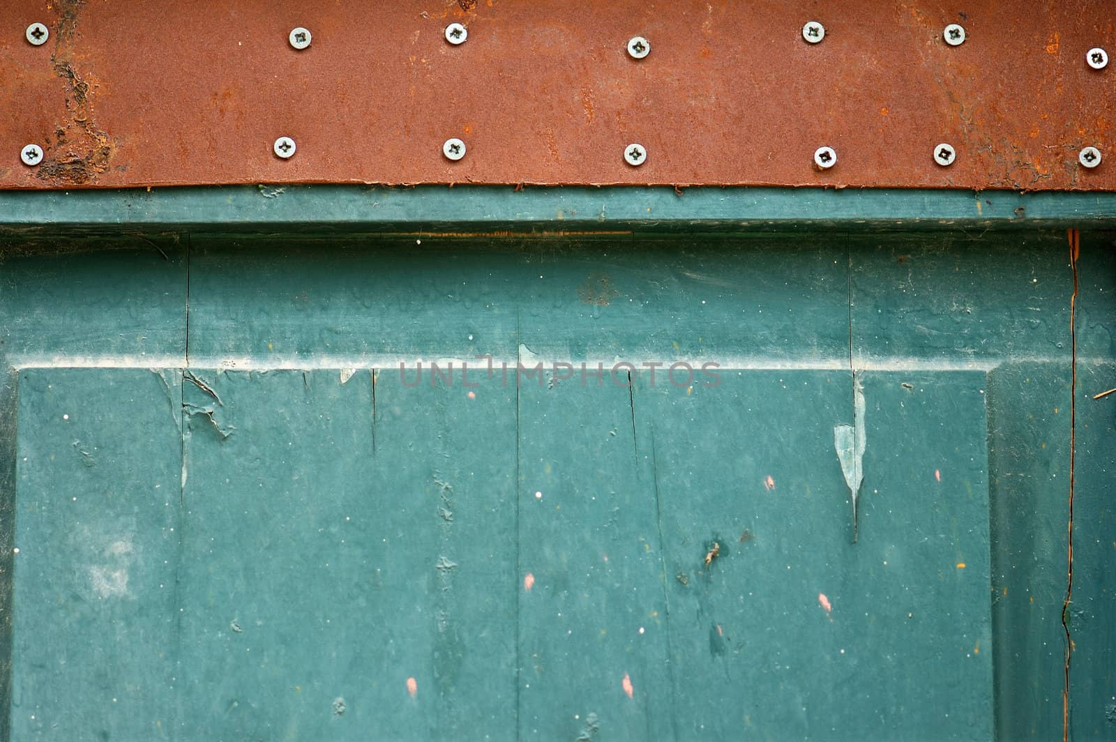 Wooden chipped paint blue door detail. Weathered wood background texture.