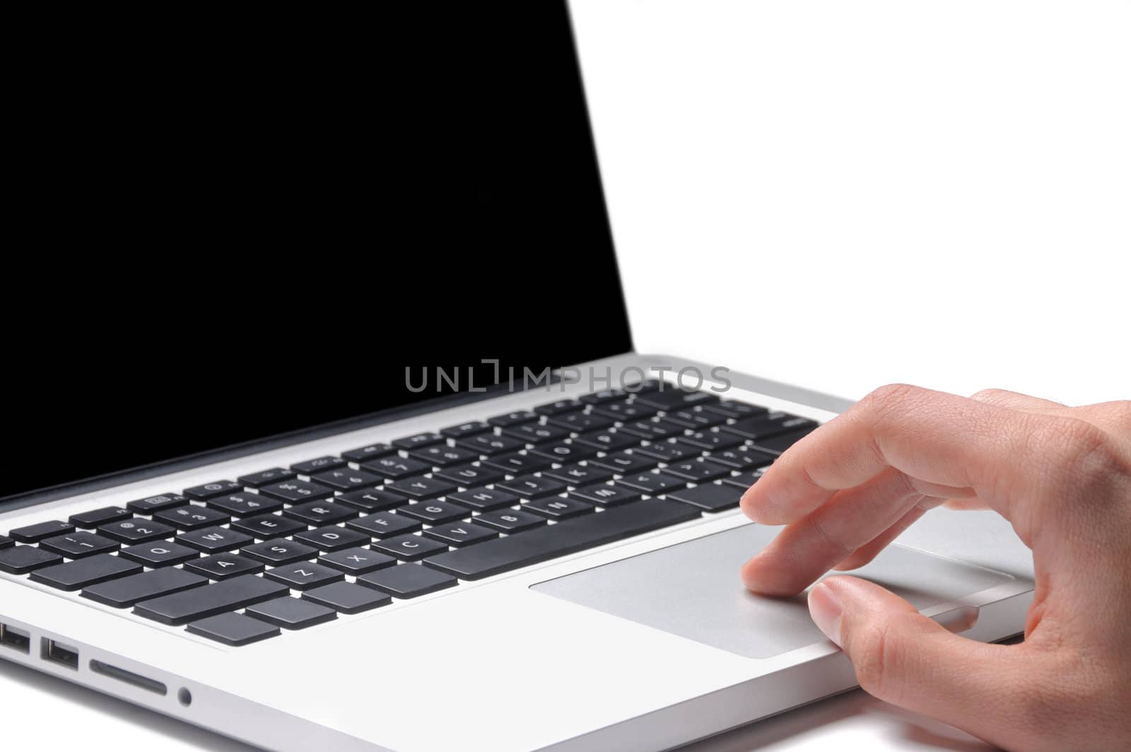 Close-up of male hand typing on laptop keyboard