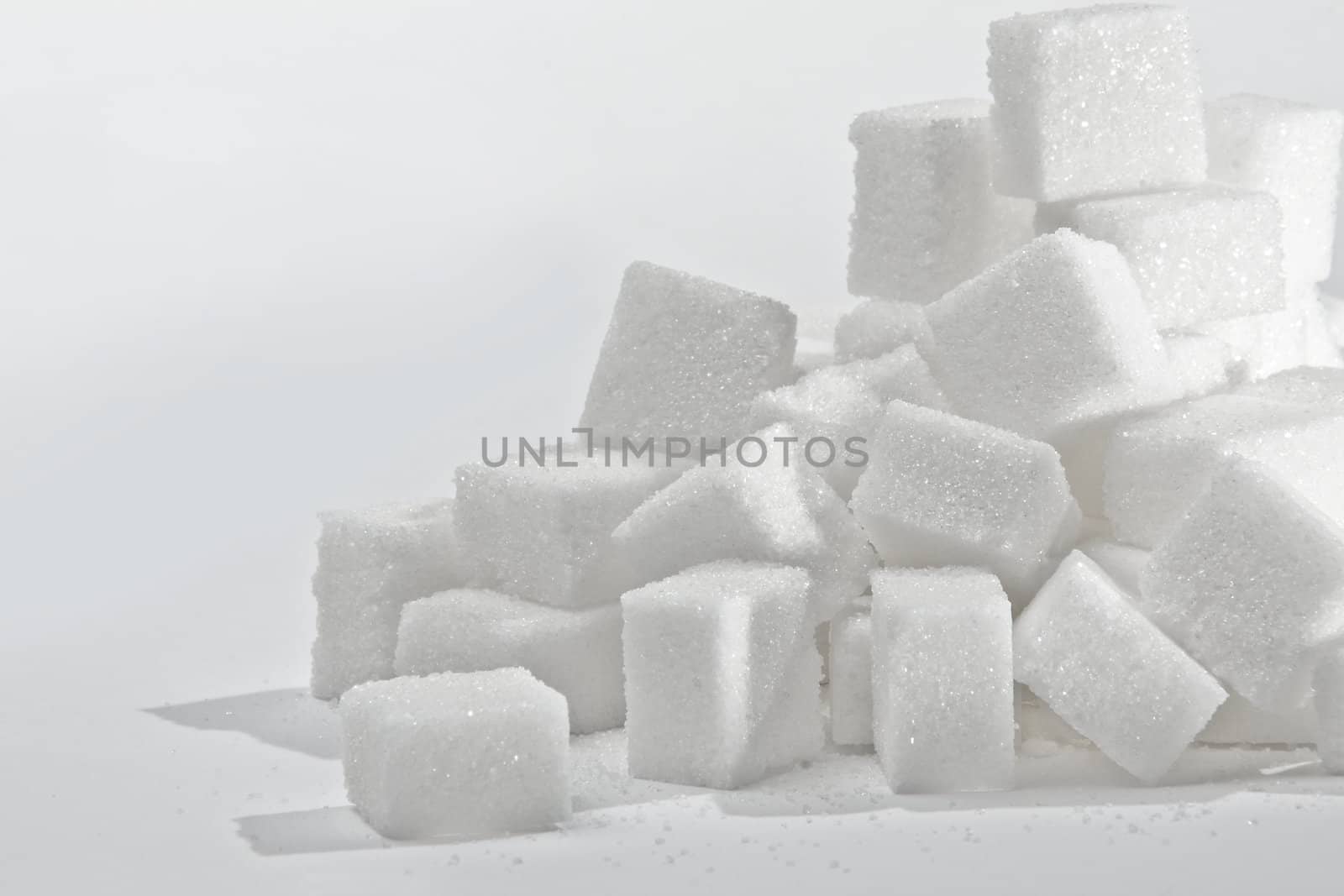 Close up on the stack of white sugar cubes.