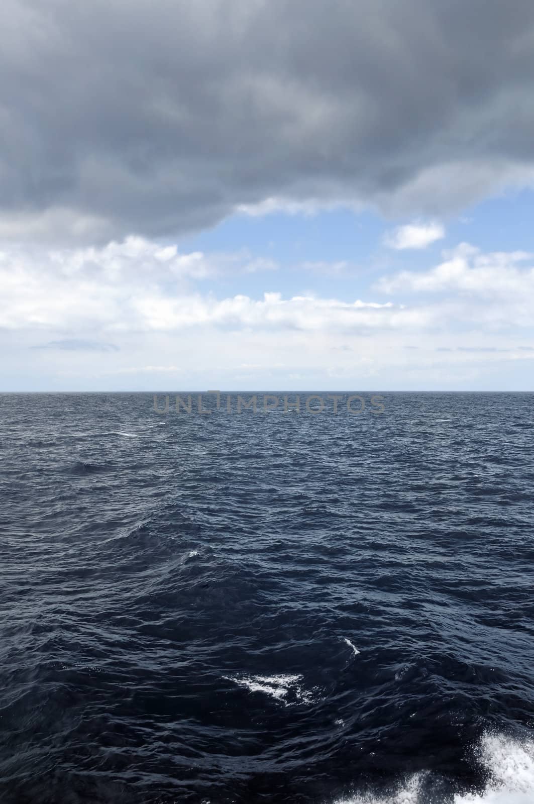 Passing through the storm. Restless deep sea water and clear coast ahead.