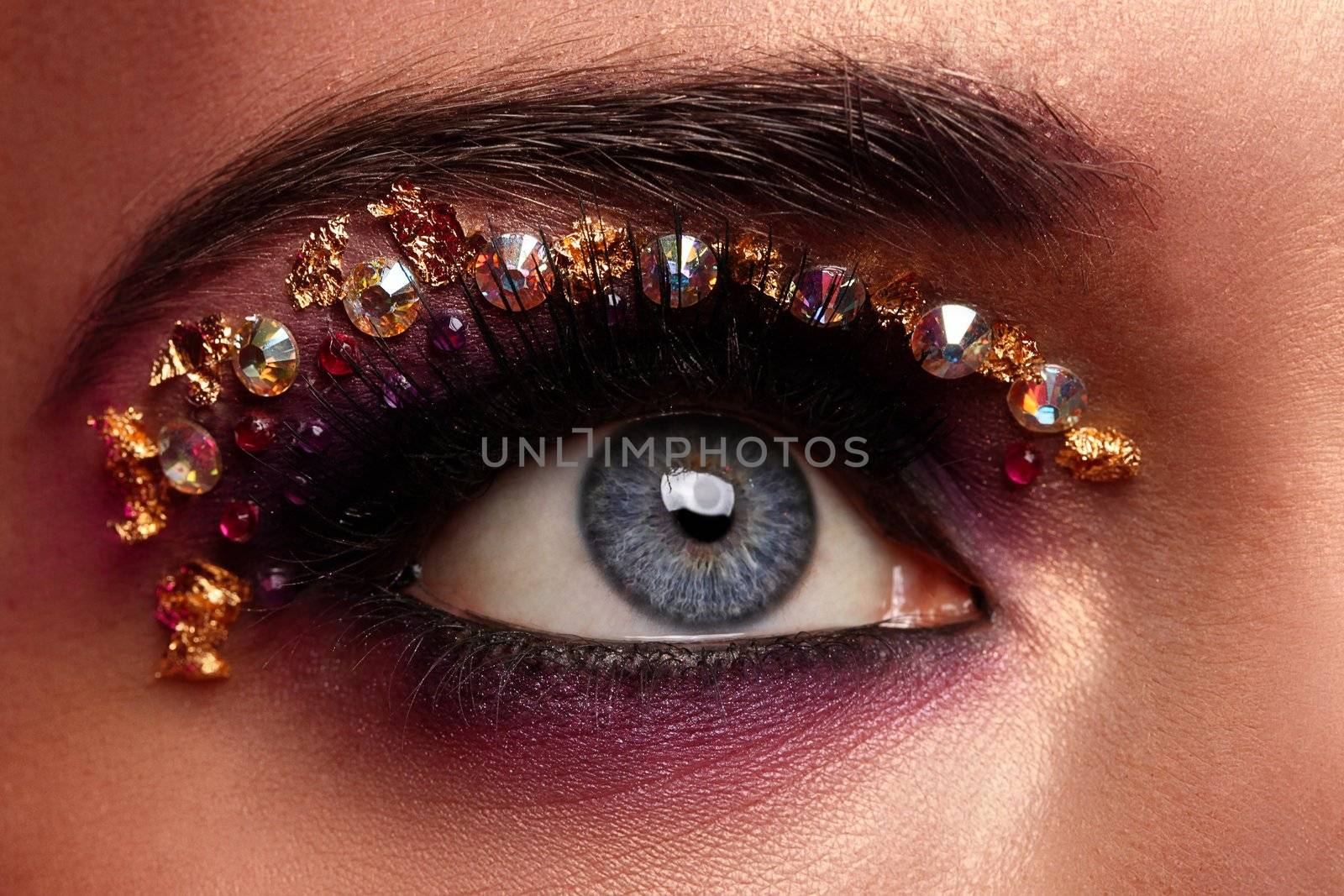 Closeup image of eye with artistic makeup by rufatjumali