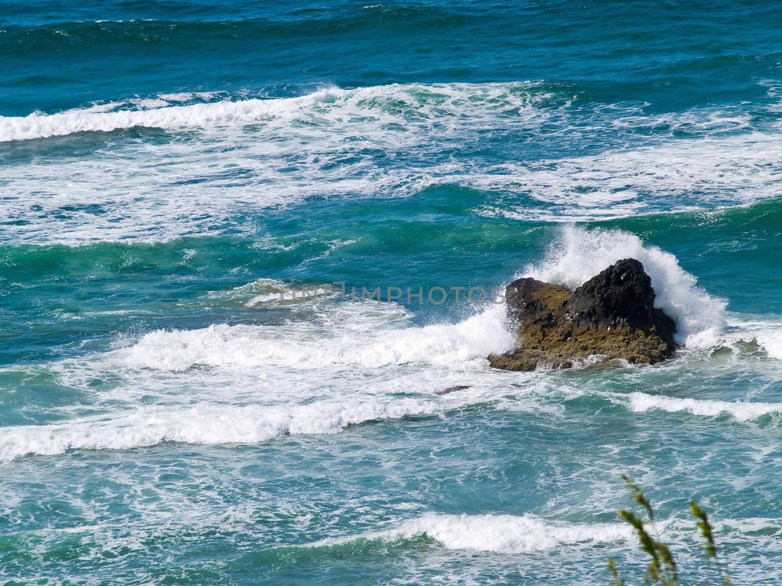 Boulder on the Shore with Waves Crashing by Frankljunior