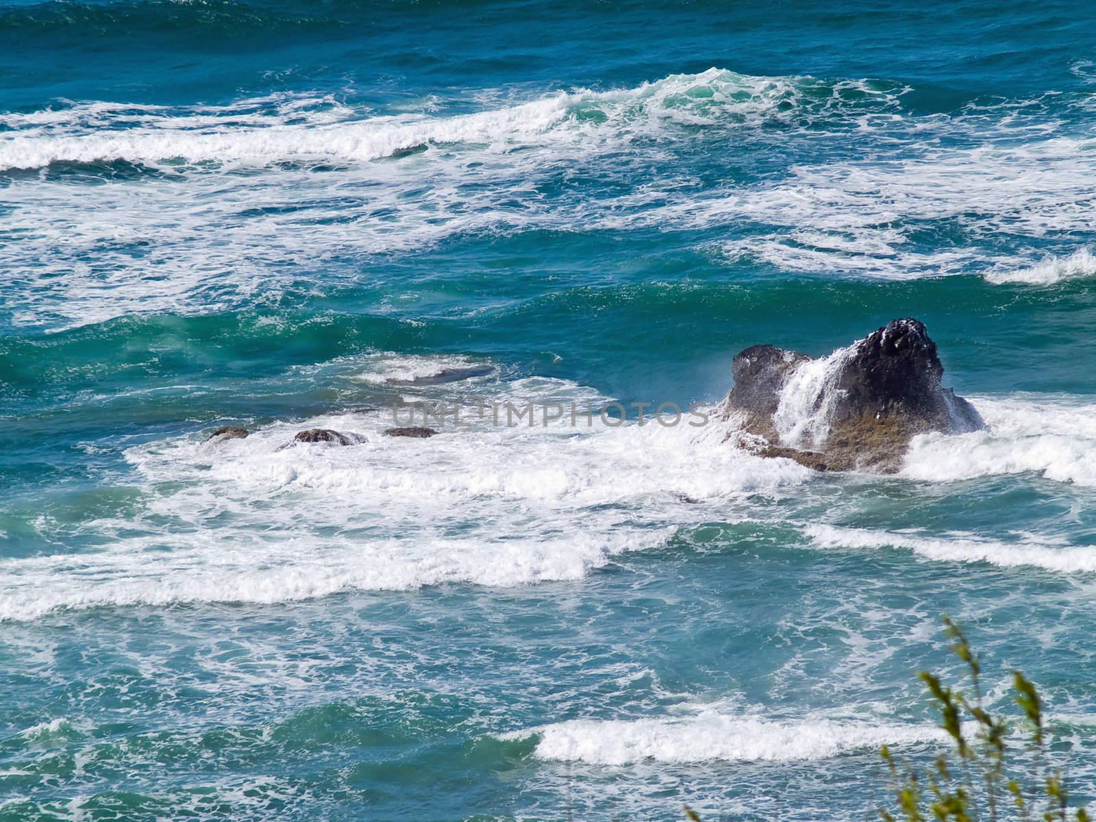 Boulder on the Shore with Waves Crashing