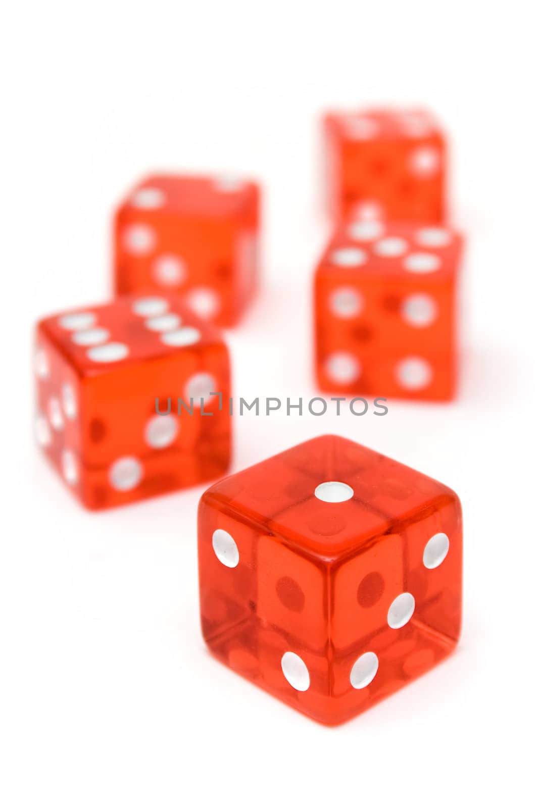 Translucent dice isolated on a white background. Shallow depth of field.
