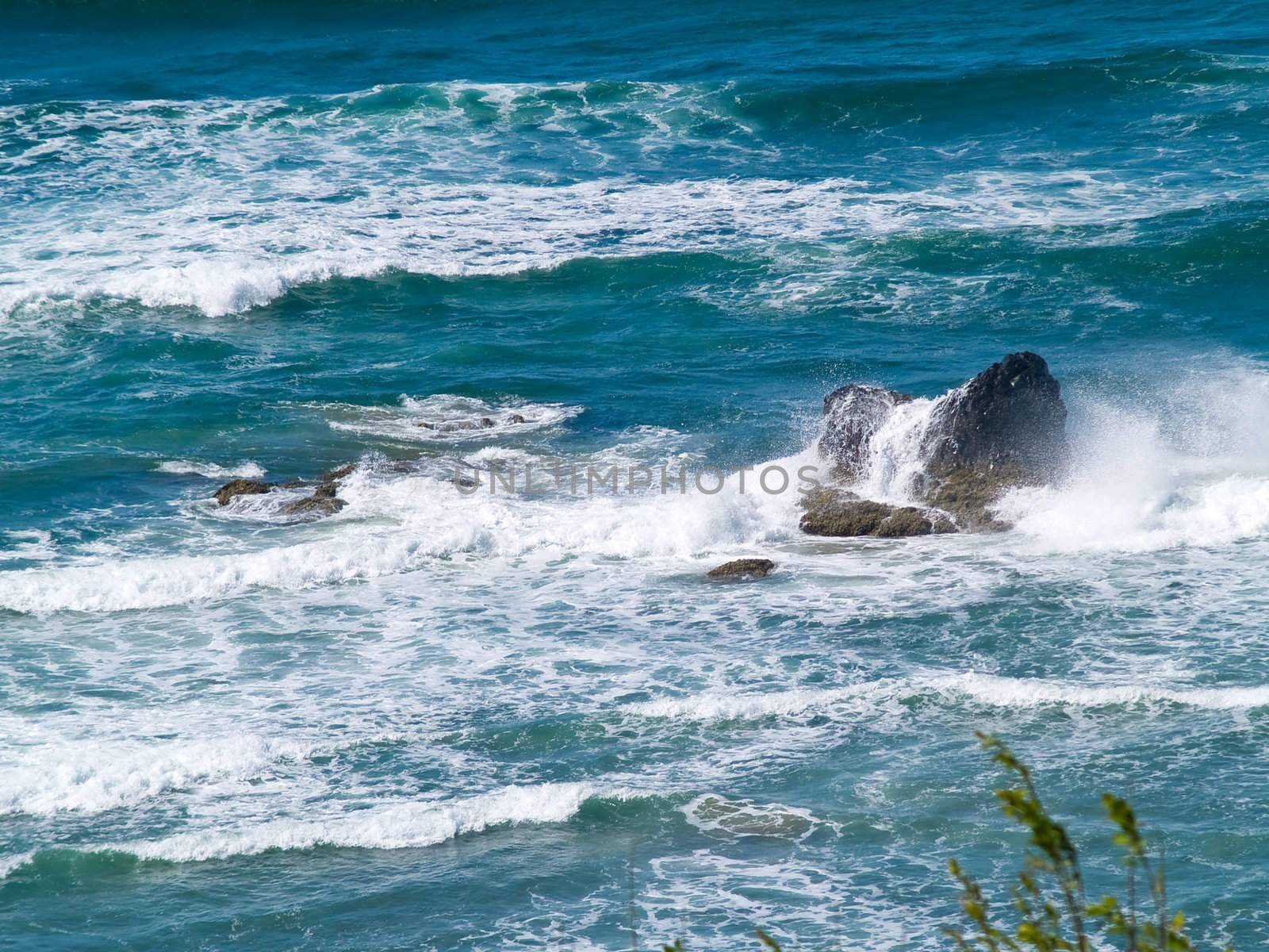 Boulder on the Shore with Waves Crashing