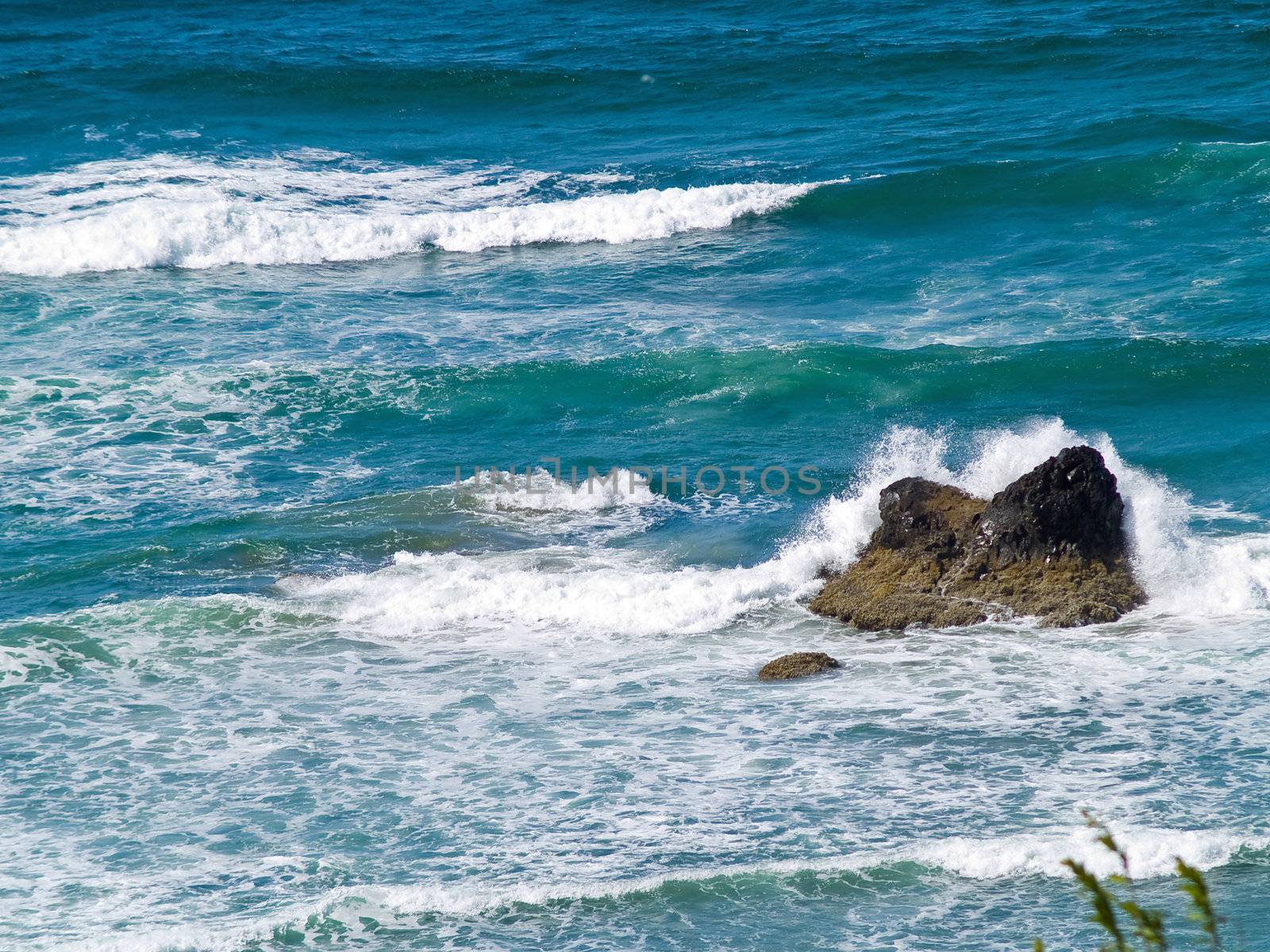 Boulder on the Shore with Waves Crashing