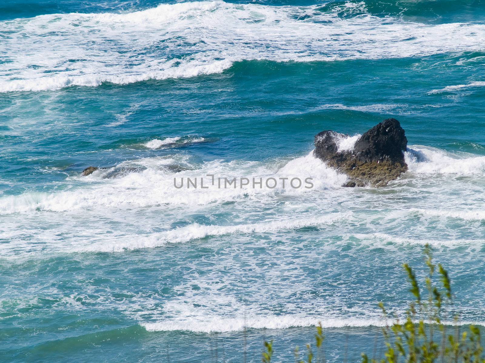 Boulder on the Shore with Waves Crashing