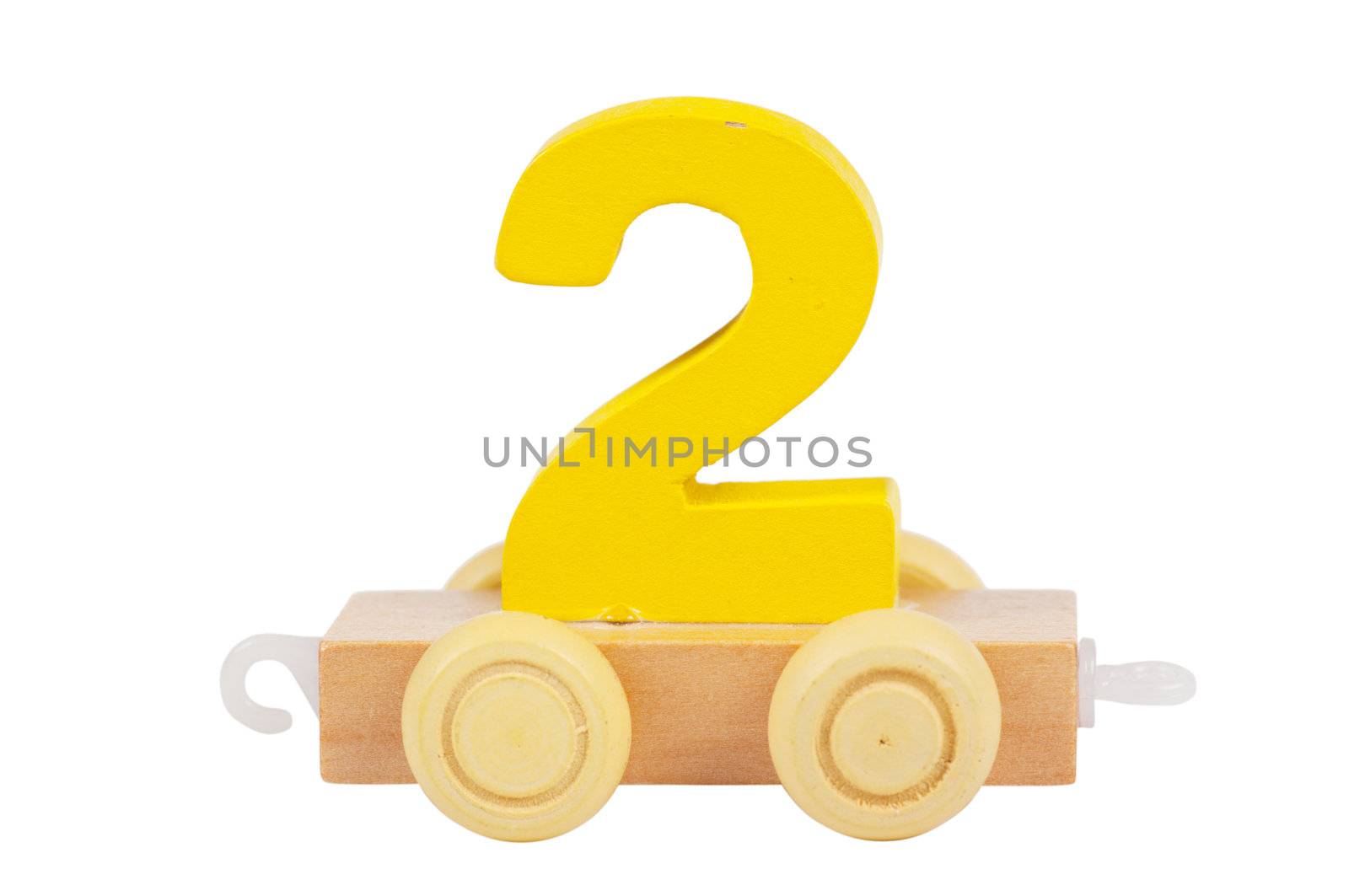 Wooden toy on a wheels number 2 isolated over white
