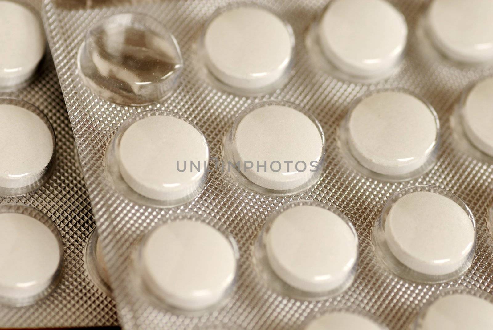 white pills in silver blister pack closeup macro