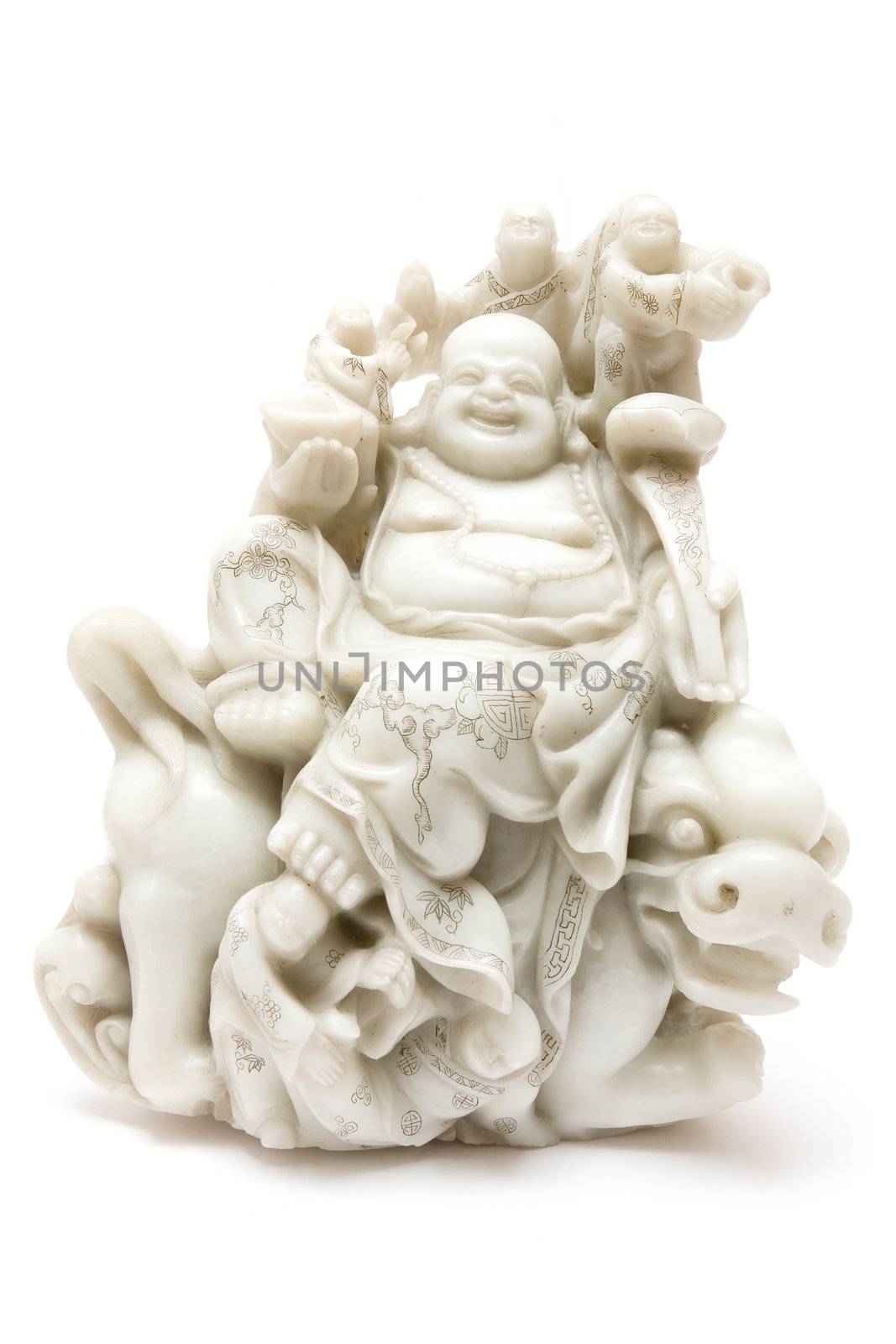 Jade buddha sitting on a dragon. Antique statue carved at the beginning of the 20th century. Isolated on a white background.