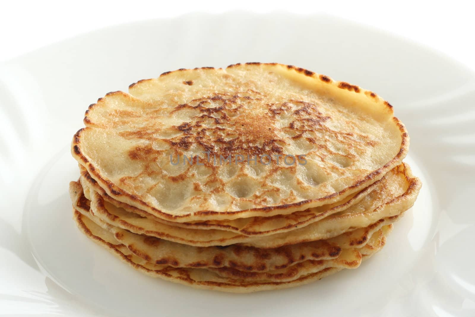 pancakes on a plate by nataliamylova