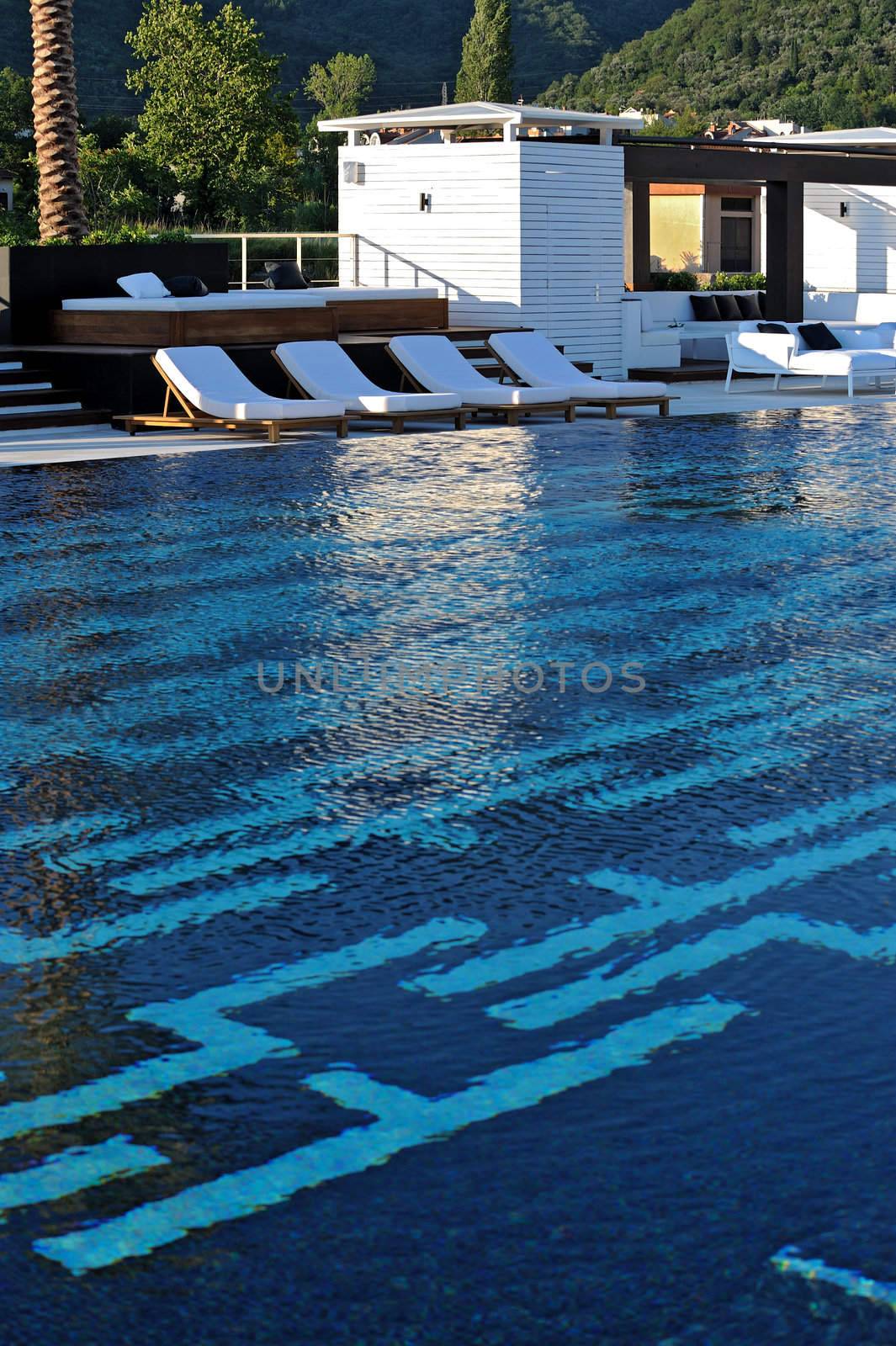 Swimming pool with chairs for relax