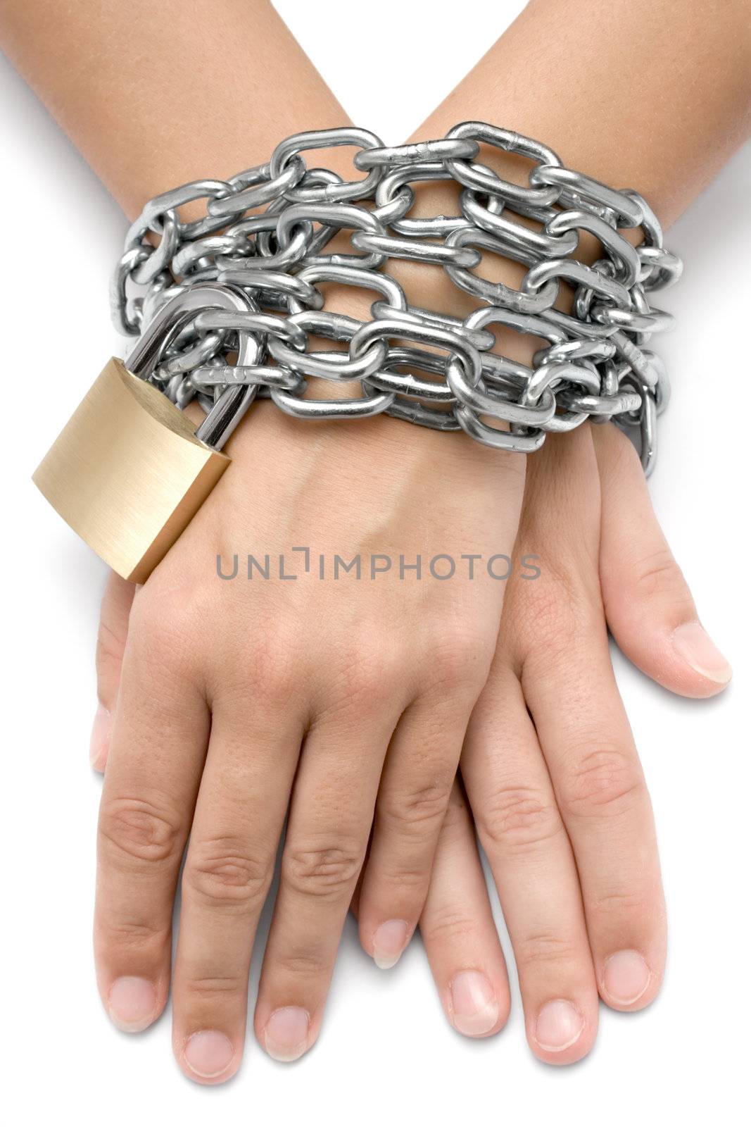 Female hands locked with a metal chain and padlock. Isolated on
a white background.