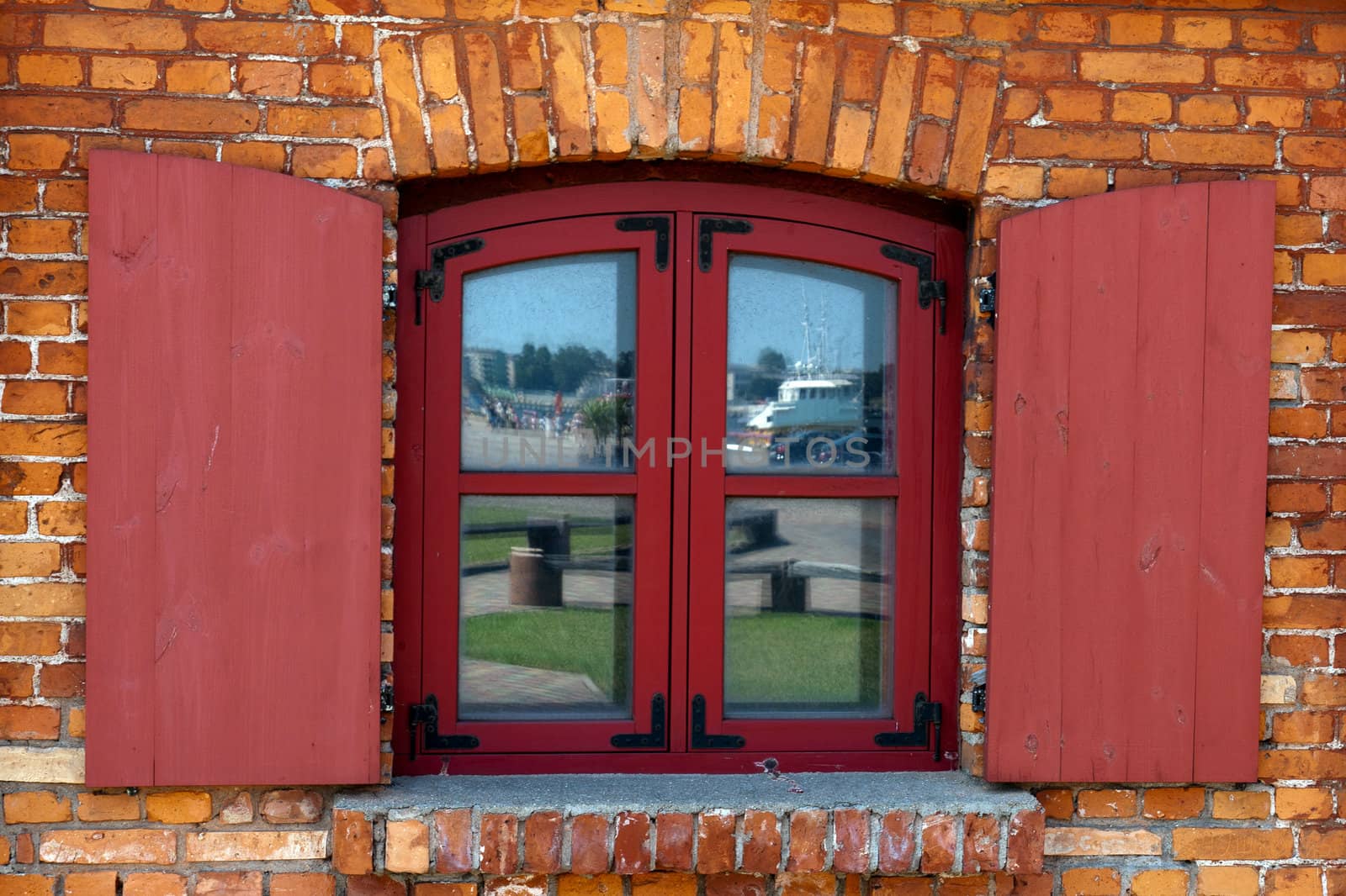 Vintage Wooden window on red brick wall