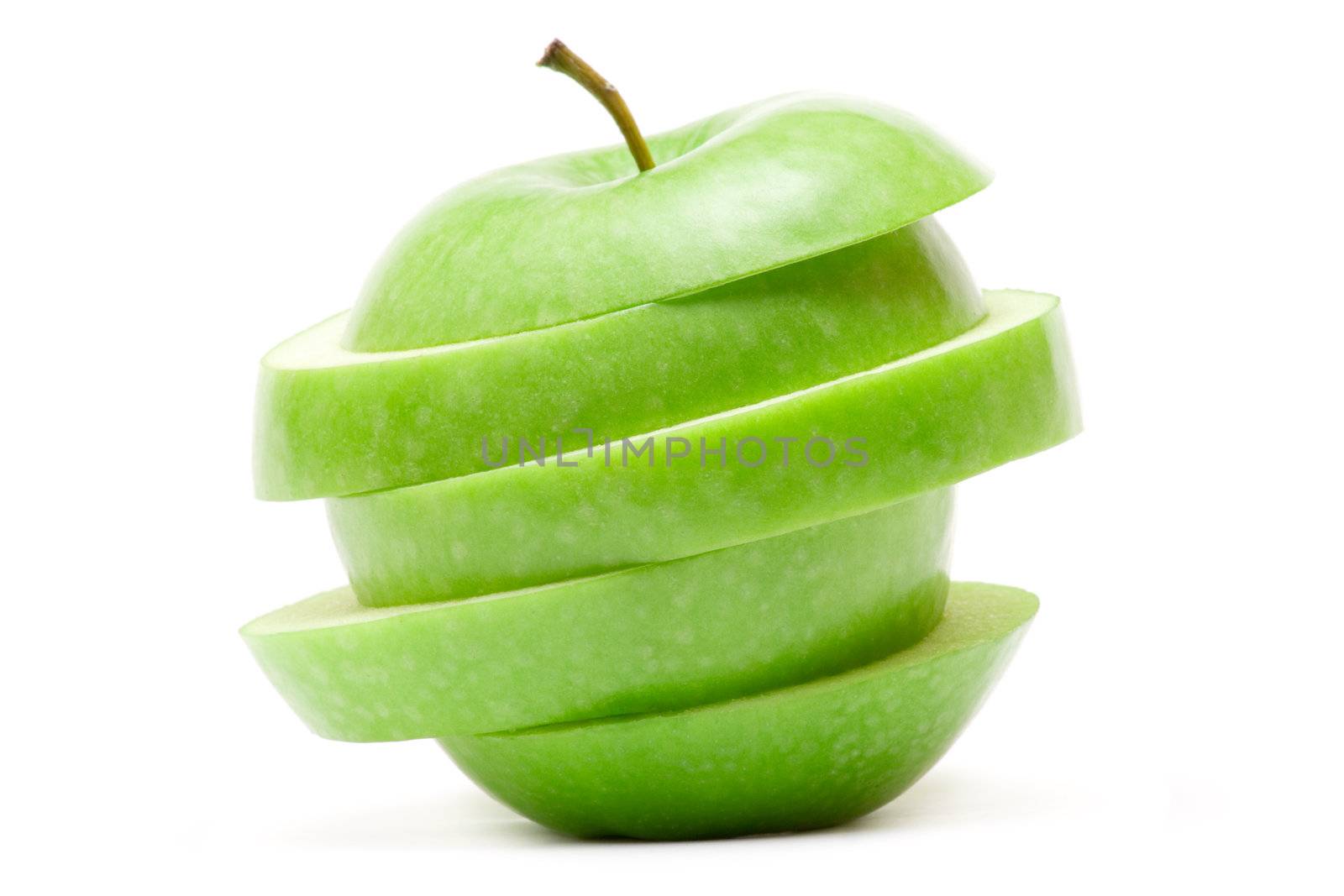 Sliced green apple isolated on a white background.