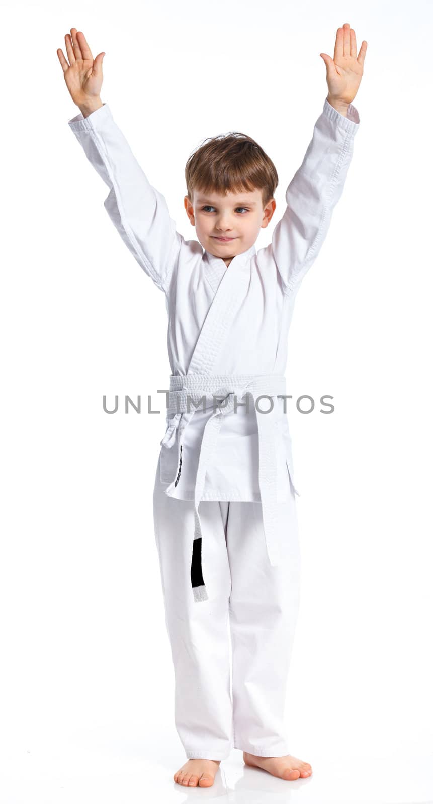 Aikido boy fighting position in white kimono isolated on white