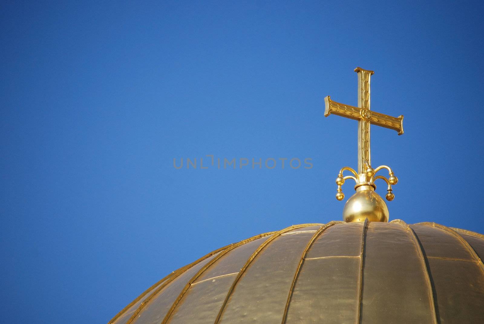 Golden cross and dome close-up by varbenov