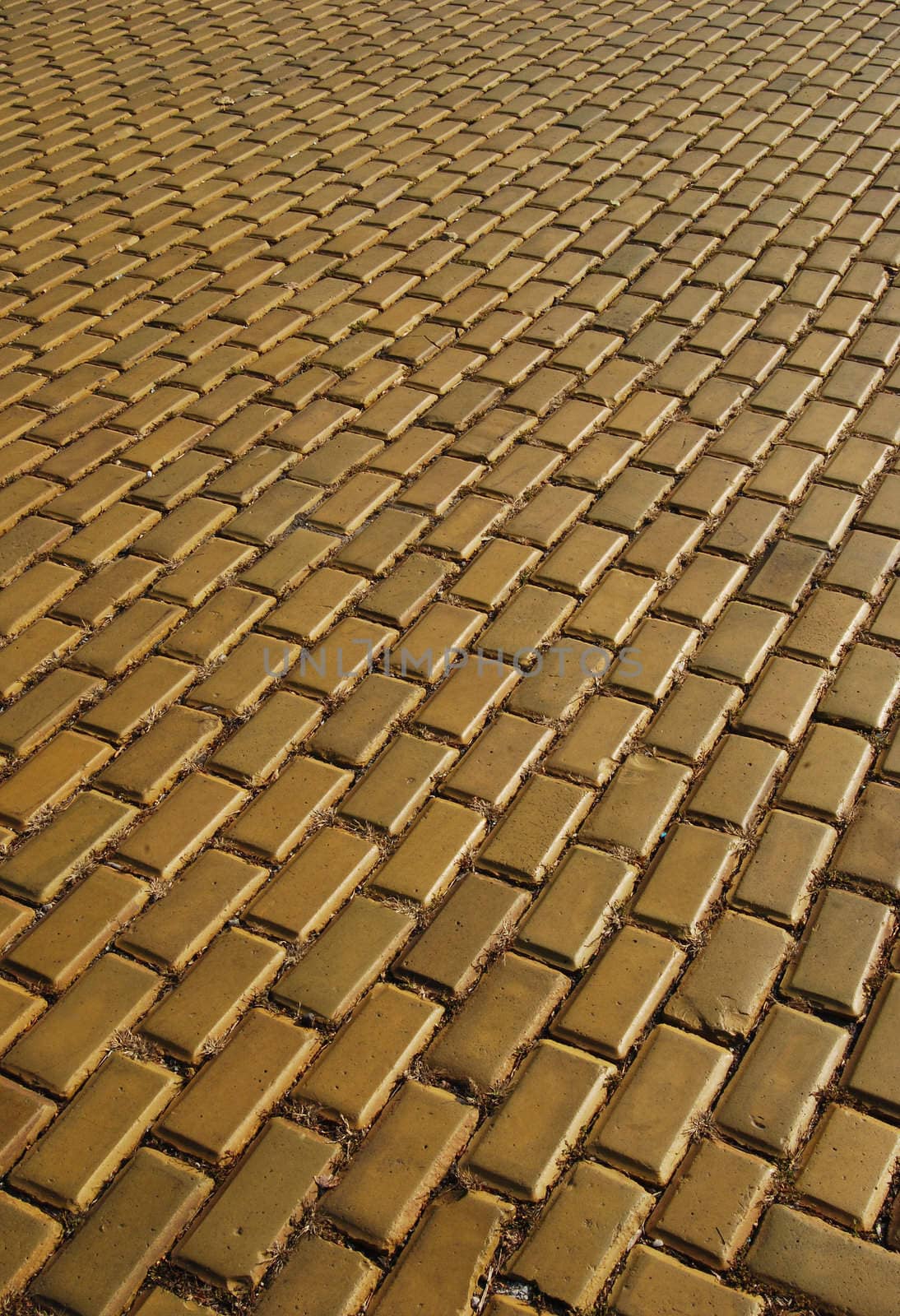 Yellow ceramic town pavement close-up and perspective