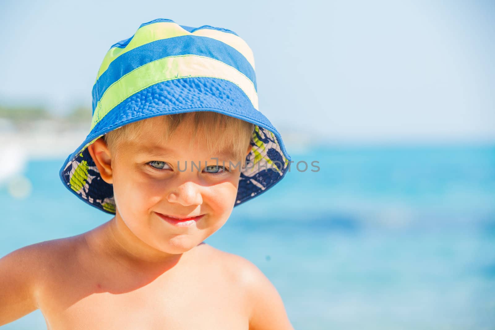 People series: portarit of boy on summer sea beach