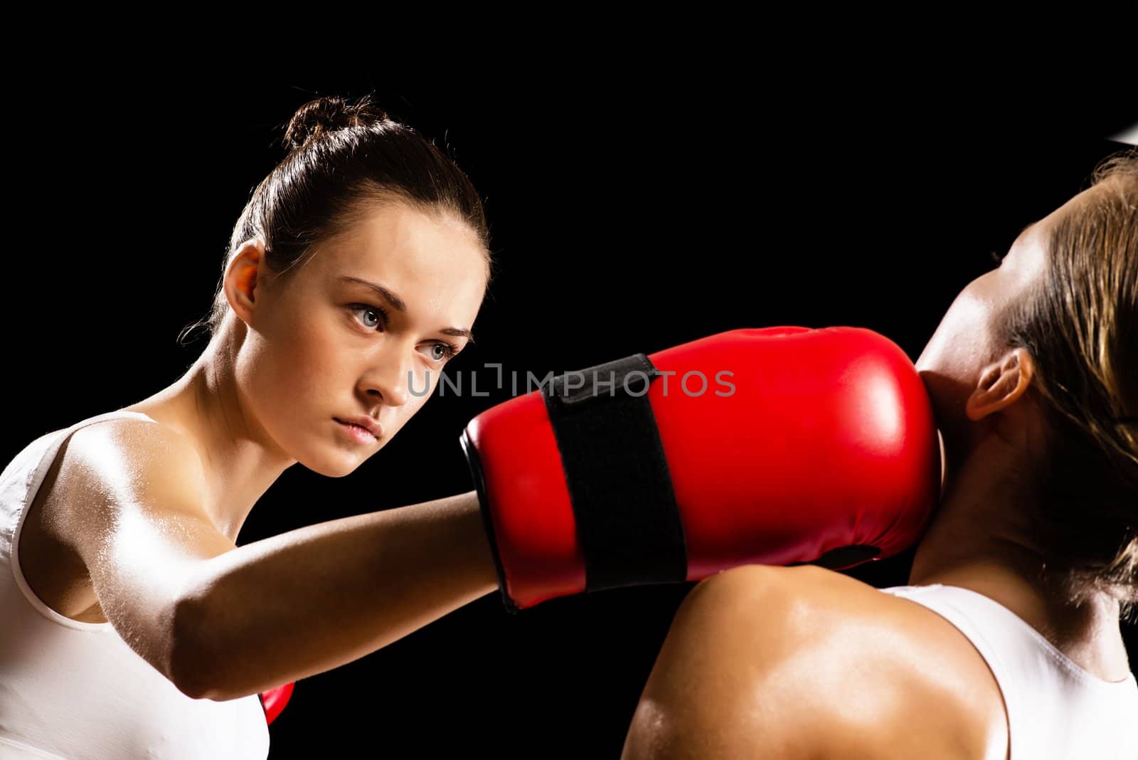 Aggressive boxing woman, hits an opponent in the head