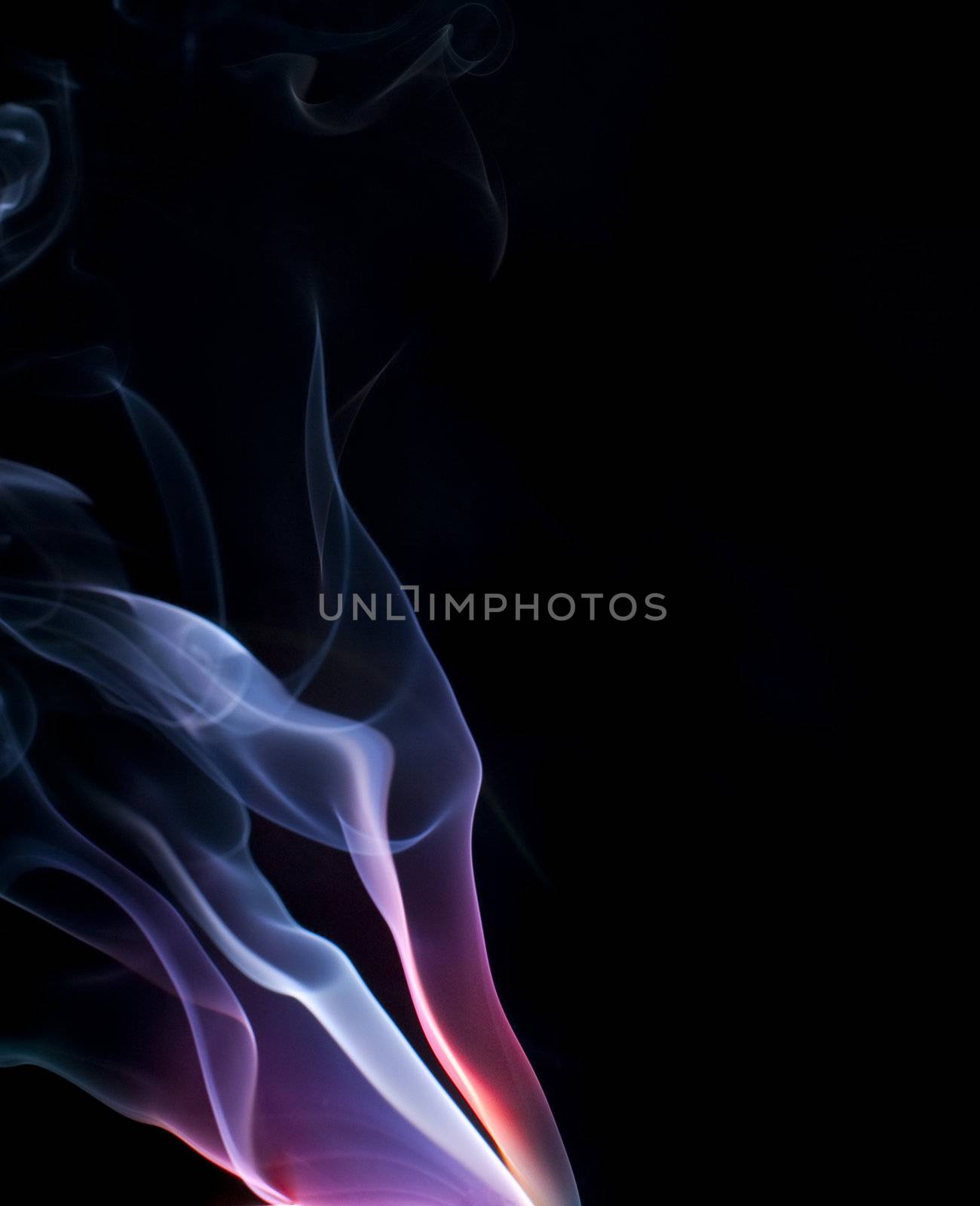colorful purple and blue lit smoke on a black background