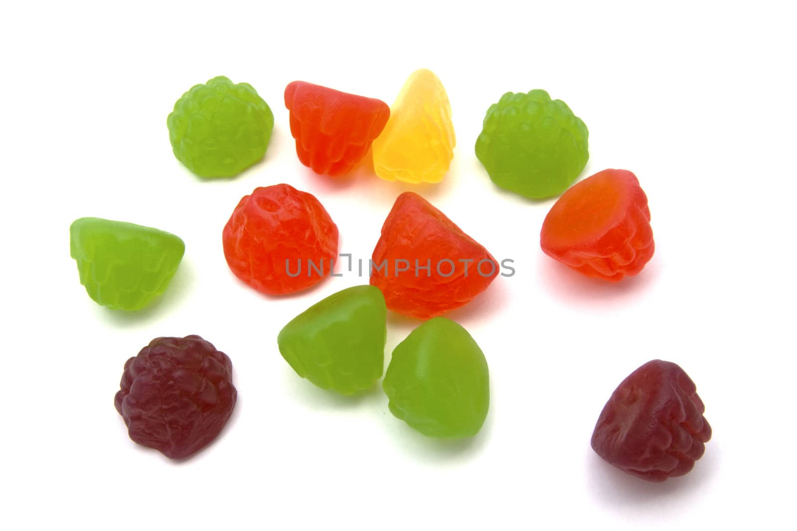 Colorful fruits candy closeup on white background 
