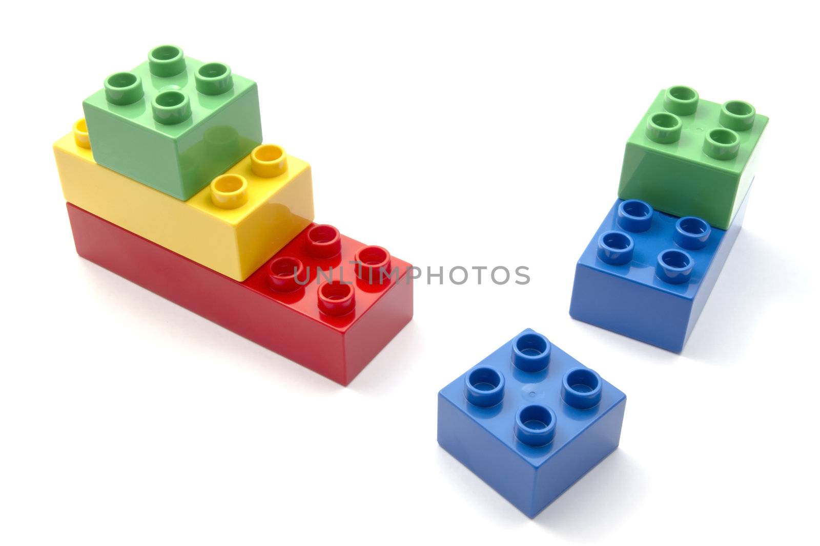 Colorful building blocks closeup on white background 