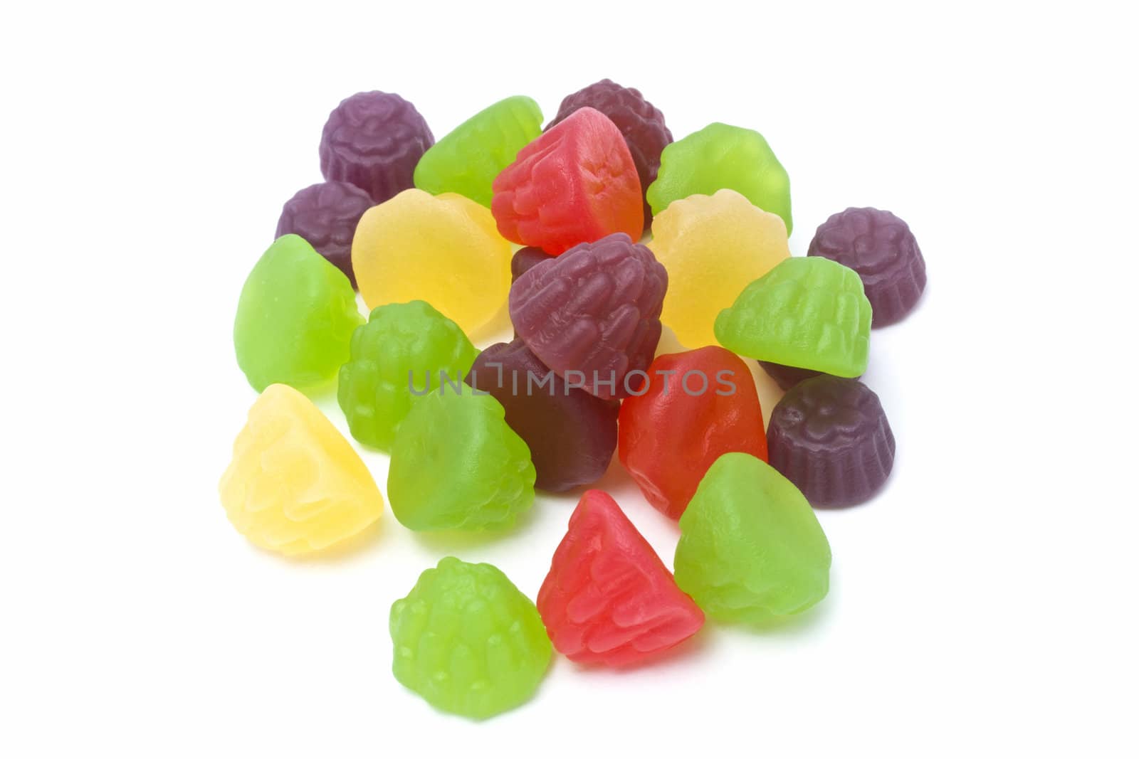 Colorful fruits candy closeup on white background
