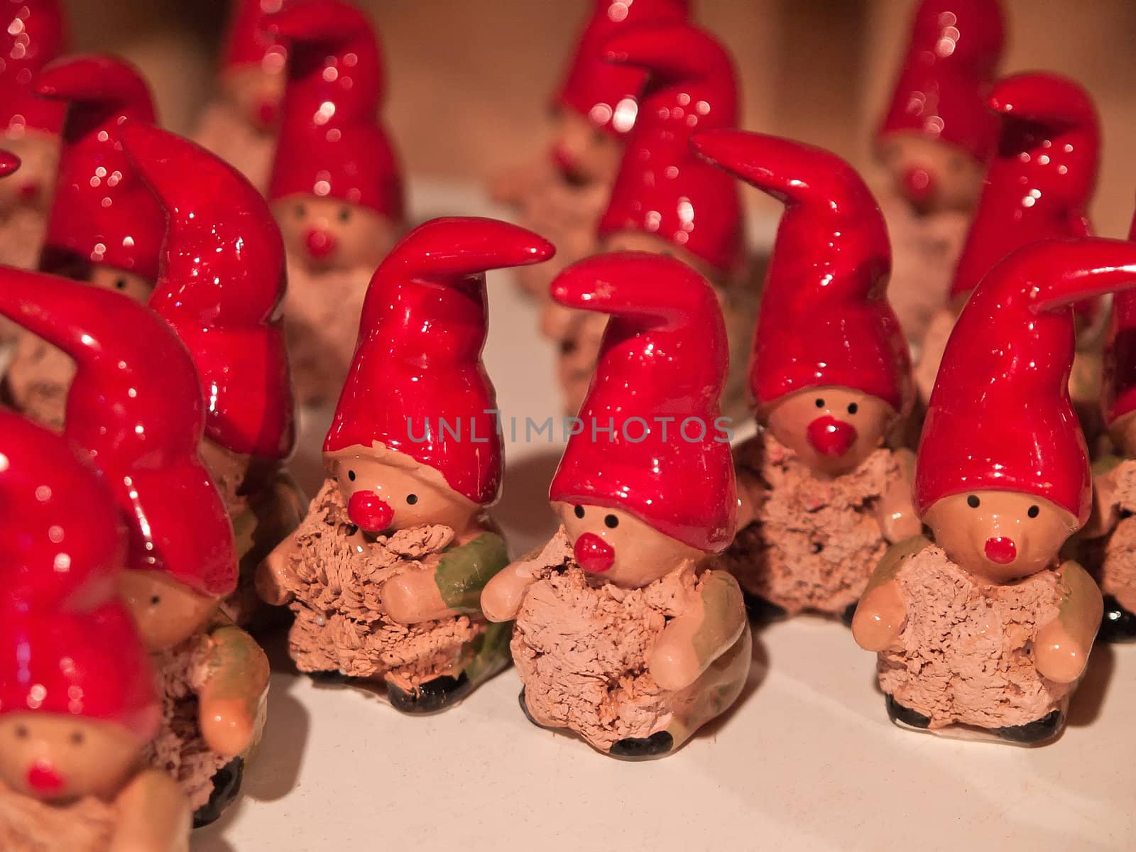 Classical Christmas Elf dwarf gnome porcelain figurines on display in a shop