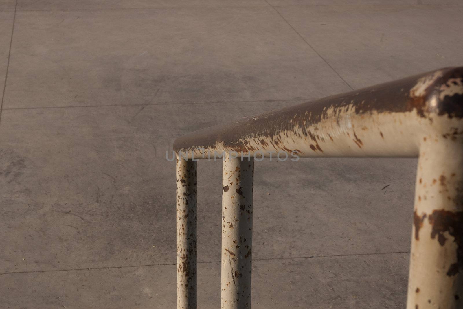 worn skateboarding rail at skate park used for rail sliding