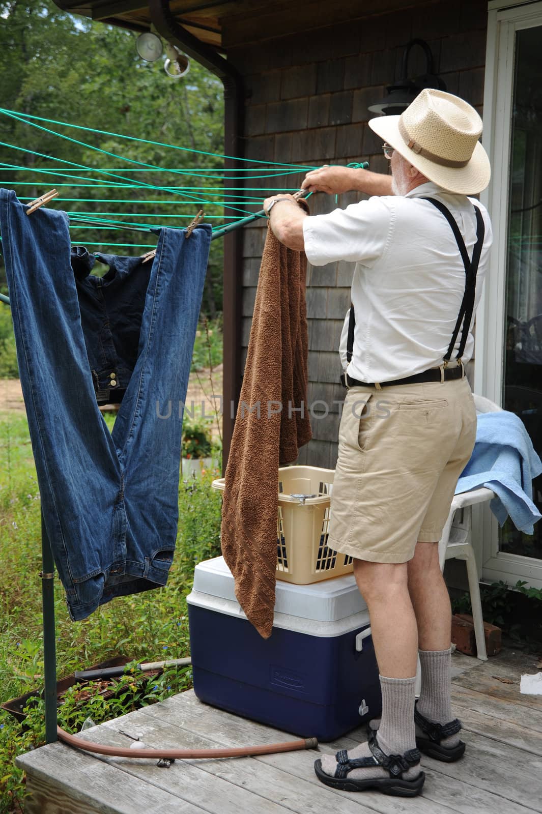 Country gentleman washing his clothes on wash day.