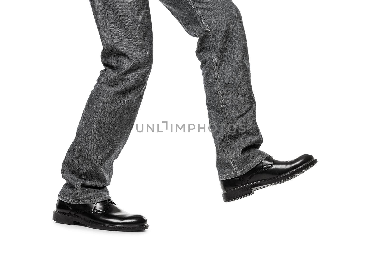 Business man in black shoes walking for next achievement or promotion step white isolated