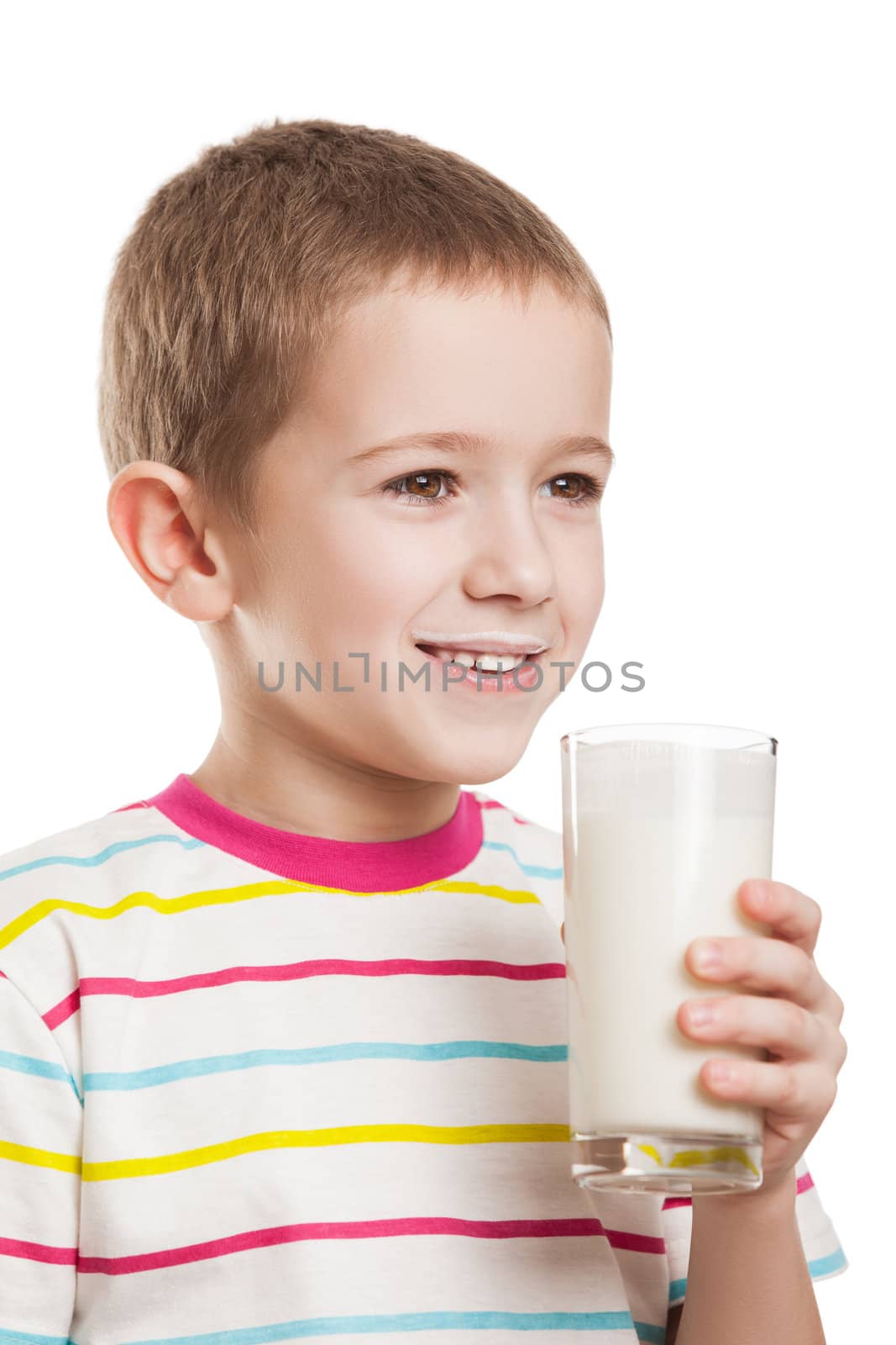Smiling child boy drinking milk by ia_64