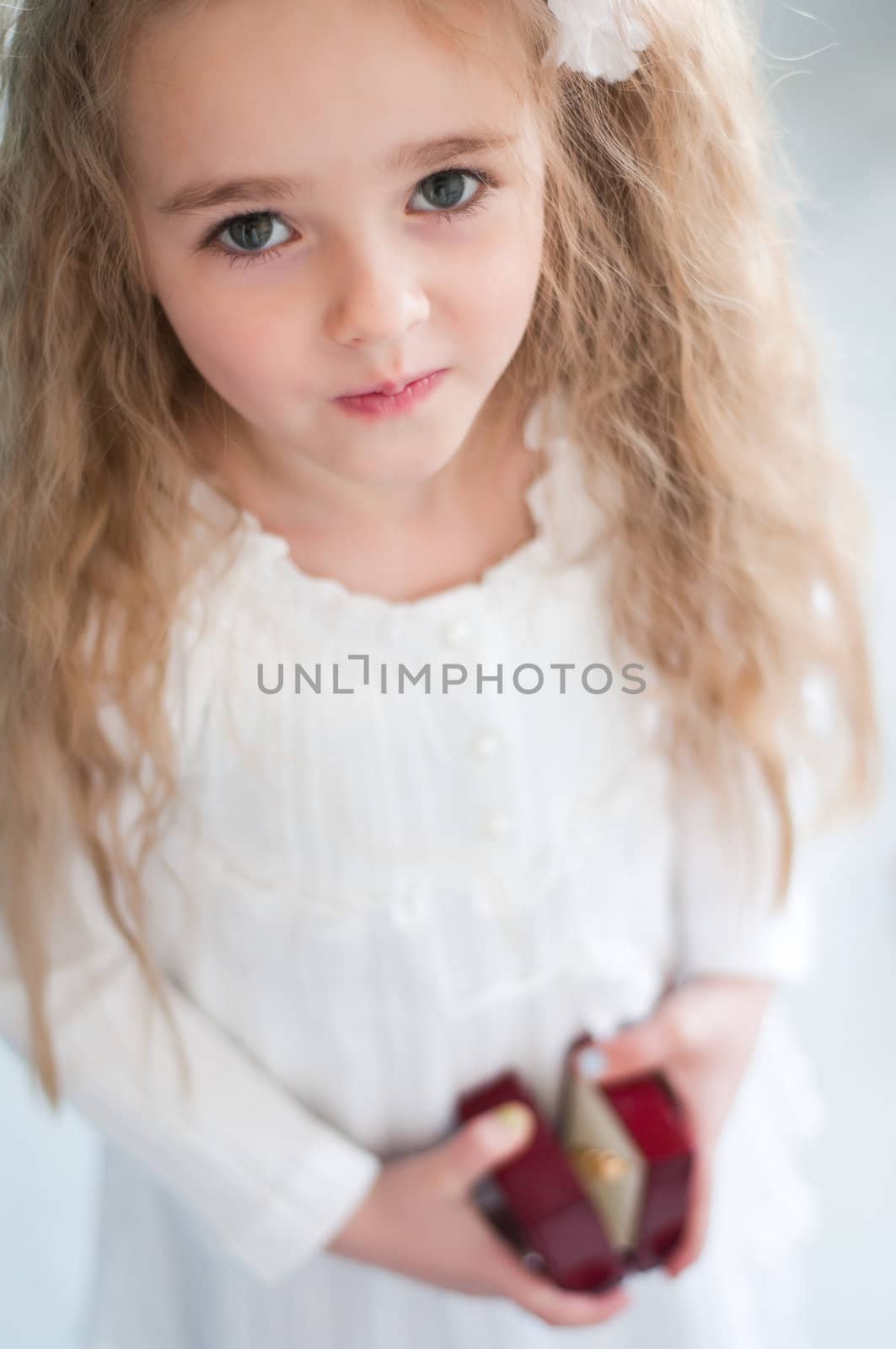 Beautiful girl with small box in hands by anytka