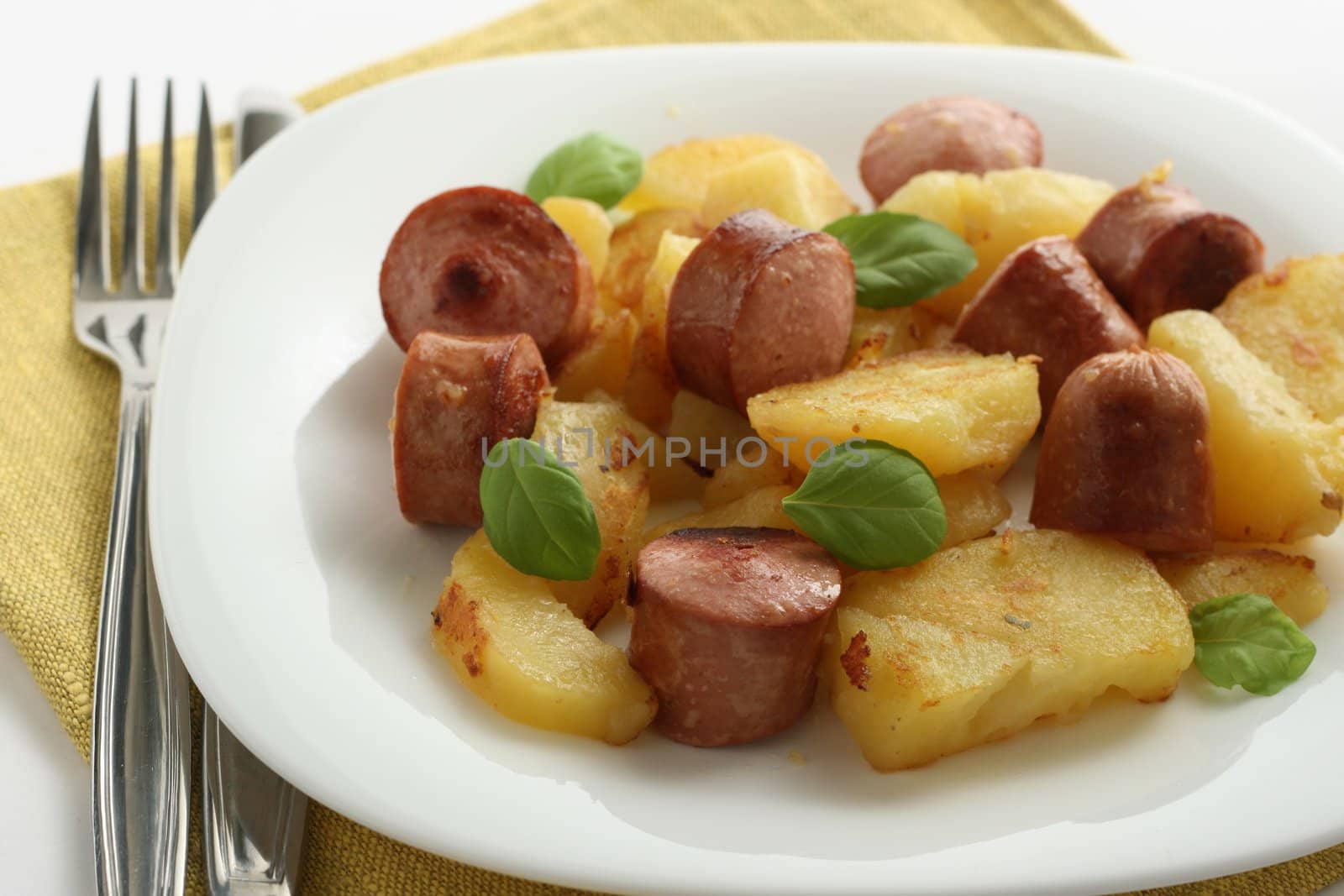 fried potato with sausages