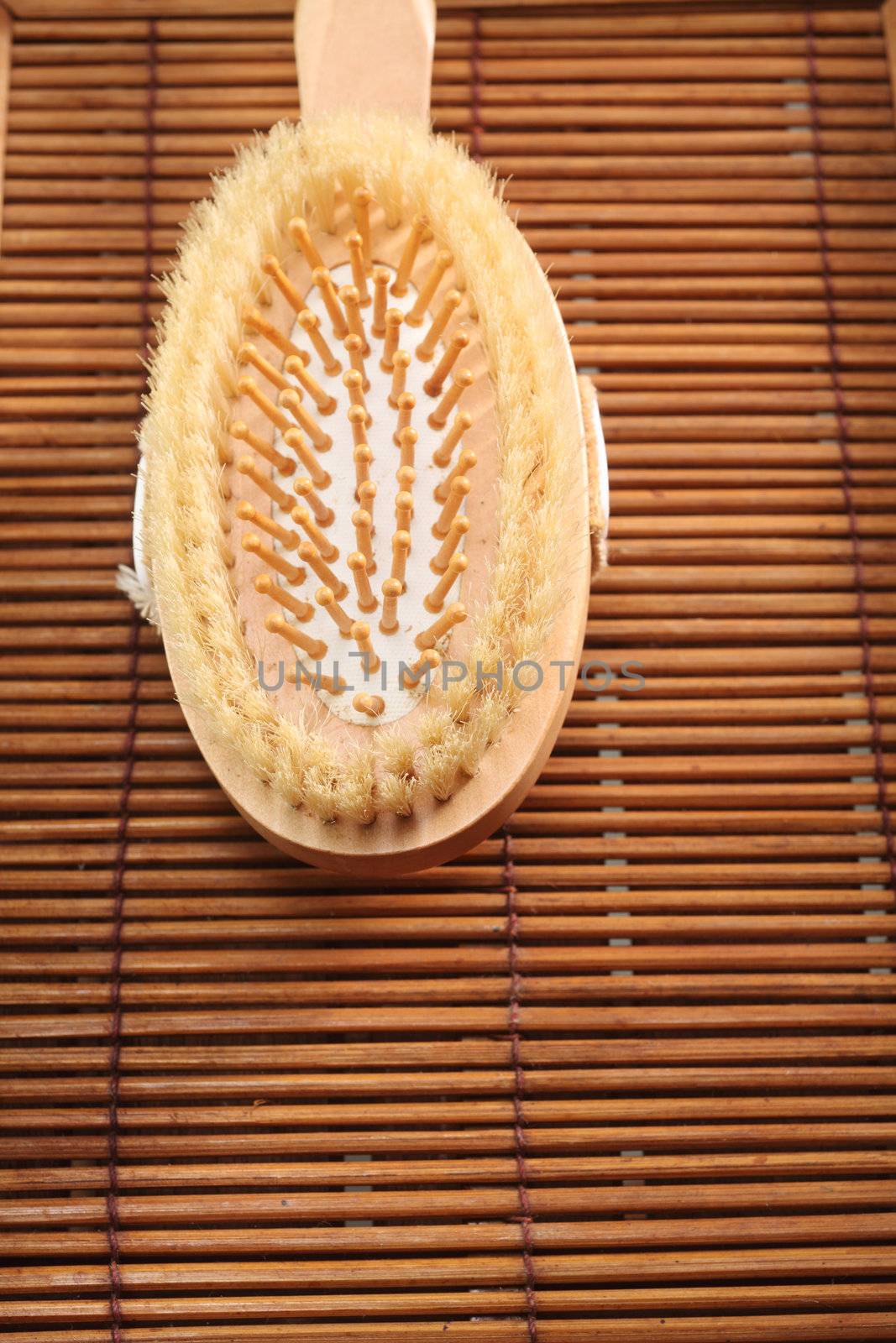 close up of the hair brush on the bamboo mat